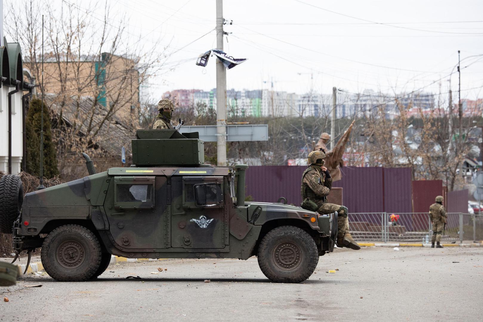 Soldiers during the evacuation the city of Irpin, northwest of Kyiv, during heavy shelling and bombing on March 5, 2022, 10 days after Russia launched a military invasion on Ukraine. Photo by Raphael Lafargue/ABACAPRESS.COM