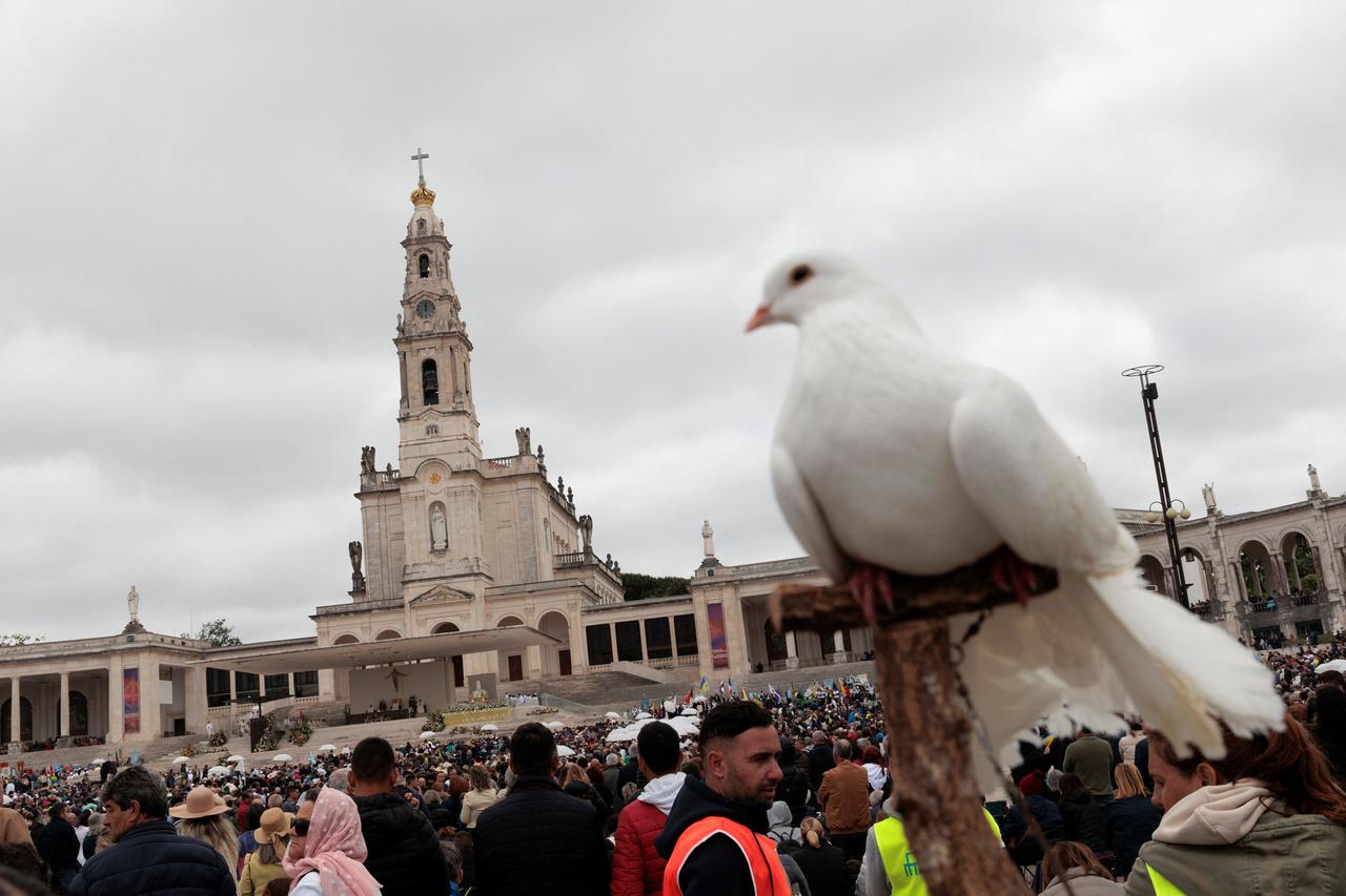 Pilgrims attend the event marking the anniversary of the reported appearance of the Virgin Mary to three shepherd children, at the Catholic shrine of Fatima