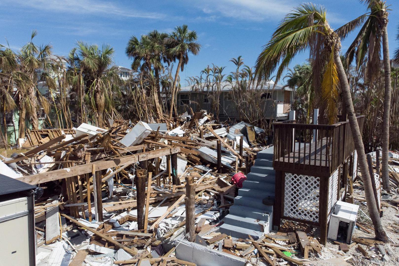 FILE PHOTO: Remains of destroyed houses are seen almost one month after Hurricane Ian landfall in Fort Myers Beach, Florida, U.S., October 26, 2022. REUTERS/Marco Bello/File Photo Photo: MARCO BELLO/REUTERS