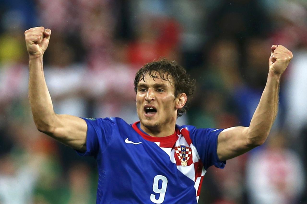 'Croatia\'s Nikica Jelavic celebrates his scoring during their Group C  Euro 2012 soccer match against Ireland at the City stadium in Poznan, June 10, 2012.  REUTERS/Sergio Perez (POLAND  - Tags: SPOR