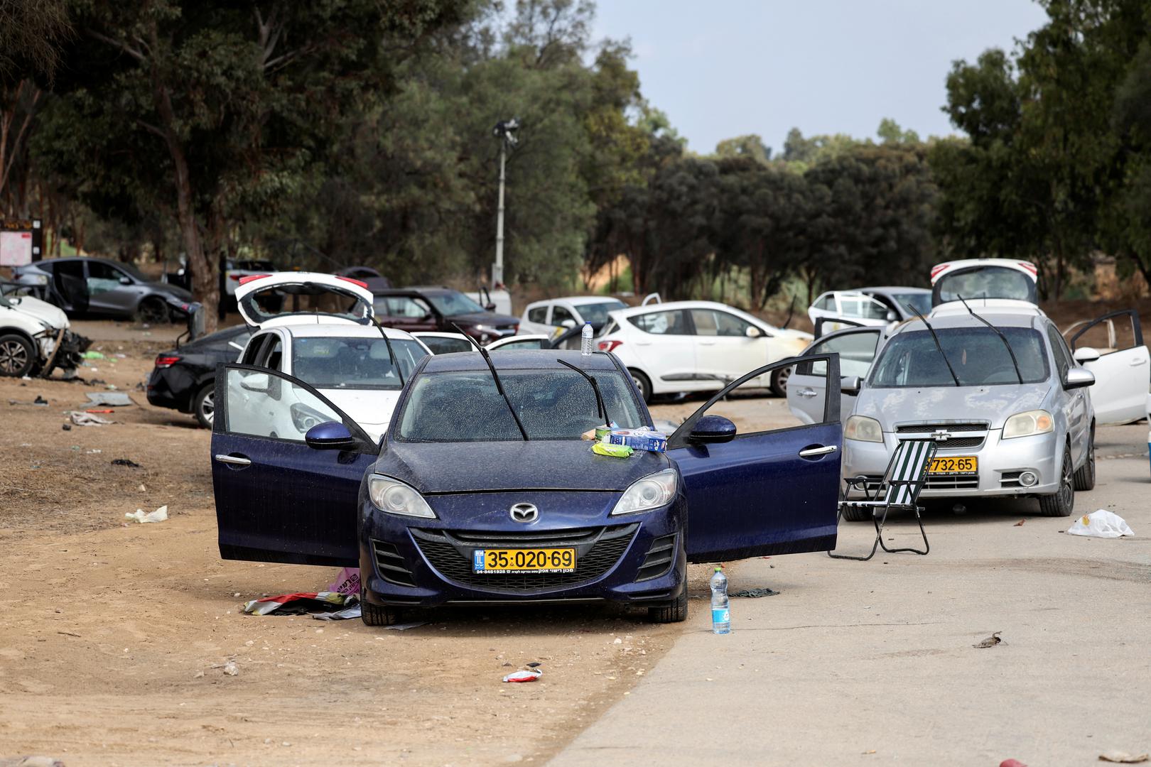 Cars are abandoned in a carpark near where a festival was held before an attack by Hamas gunmen from Gaza that left at least 260 people dead, by Israel's border with Gaza in southern Israel, October 10, 2023. REUTERS/Ronen Zvulun Photo: RONEN ZVULUN/REUTERS