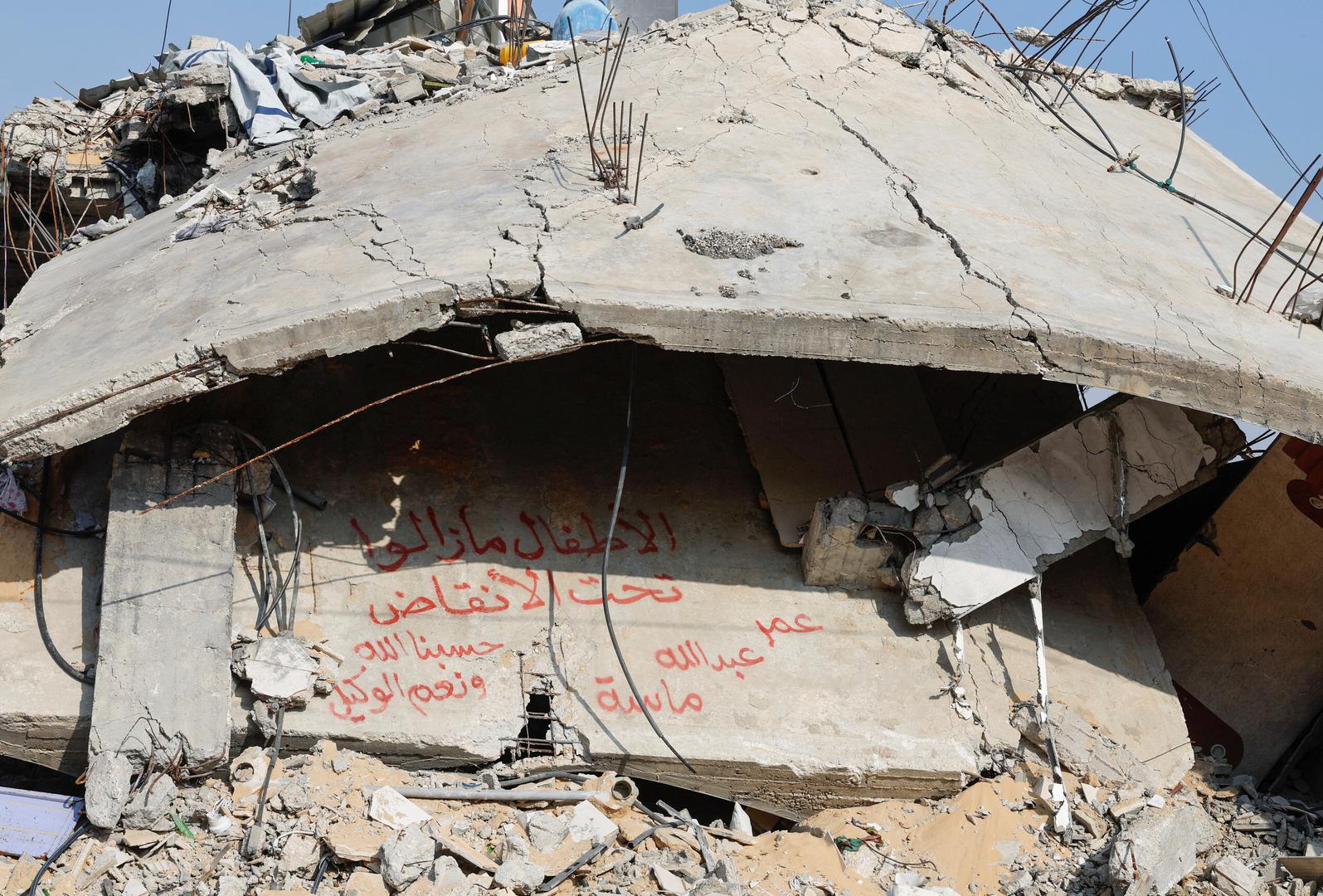 The rubble of the Abu Aweidah family's house, which was destroyed in a deadly Israeli strike amid the ongoing conflict between Israel and the Palestinian Islamist group Hamas, is seen in Rafah, Gaza Strip, January 9, 2024. The writing reads: "Children remaining under the rubble, Oman, Abdullah and Massa". REUTERS/Mohammed Salem Photo: MOHAMMED SALEM/REUTERS