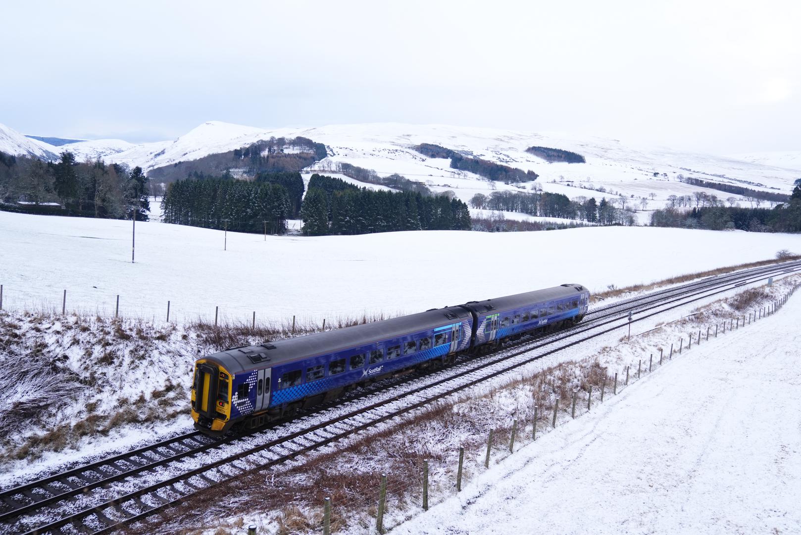 A ScotRail train in snowy conditions near Gleneagles in Perthshire. Weather warnings remain in force across much of the UK on Monday with adverse conditions, including flooding from heavy rain and thawing snow. Picture date: Monday January 6, 2025. Photo: Andrew Milligan/PRESS ASSOCIATION