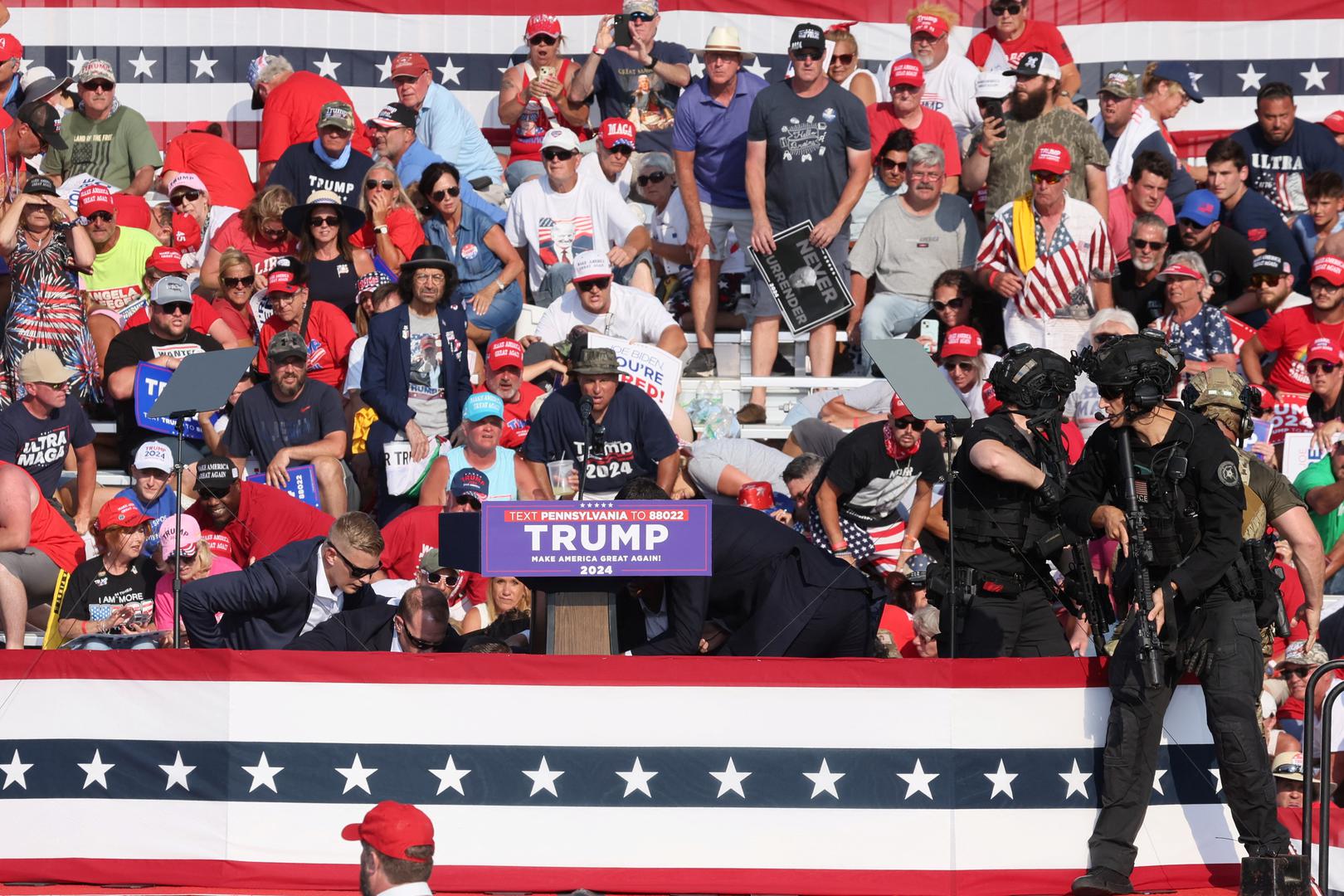 Republican presidential candidate and former U.S. President Donald Trump is assisted by U.S. Secret Service personnel after gunfire rang out during a campaign rally at the Butler Farm Show in Butler, Pennsylvania, U.S., July 13, 2024. REUTERS/Brendan McDermid Photo: BRENDAN MCDERMID/REUTERS