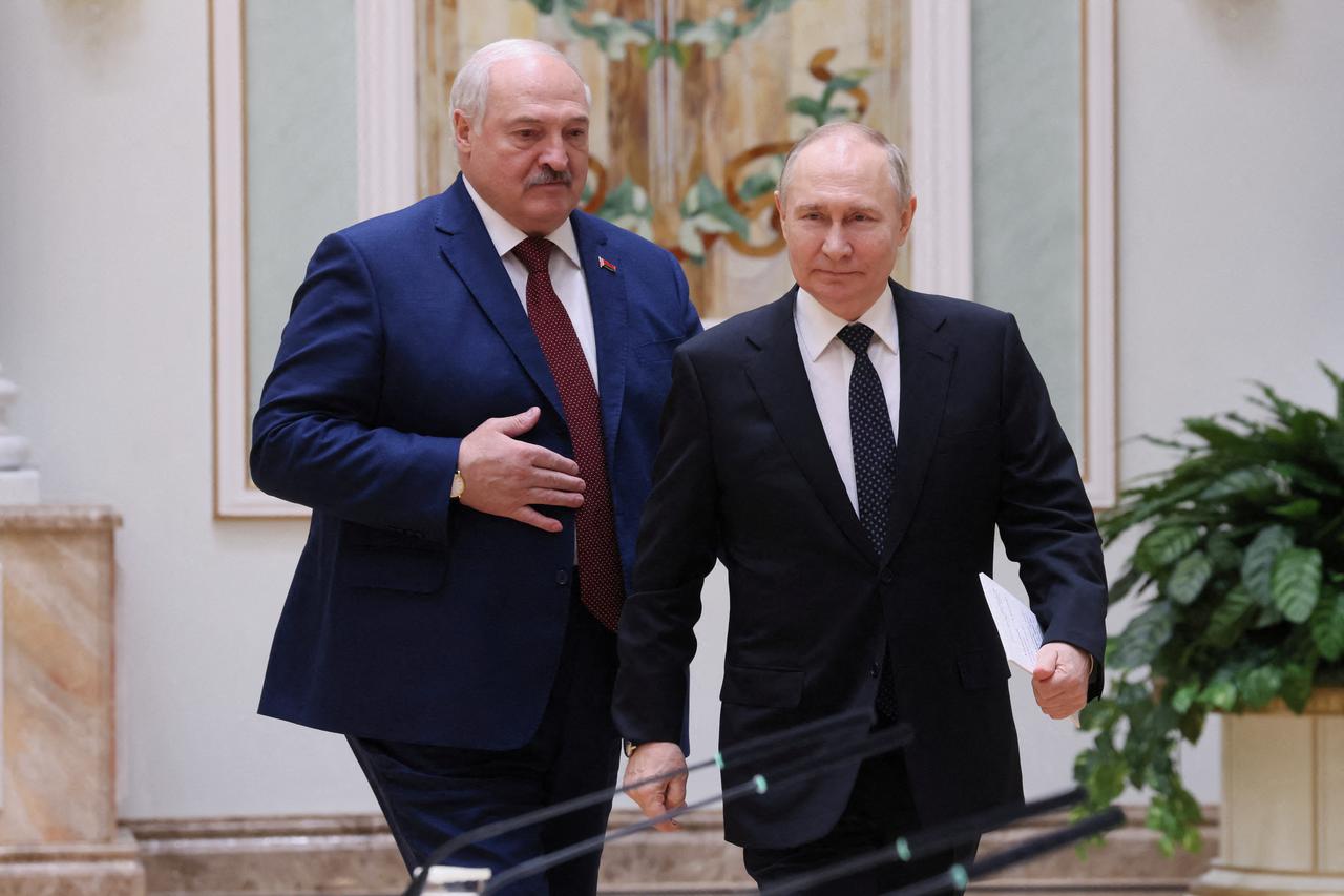 FILE PHOTO: Russian President Putin and Belarusian President Lukashenko meet in Minsk