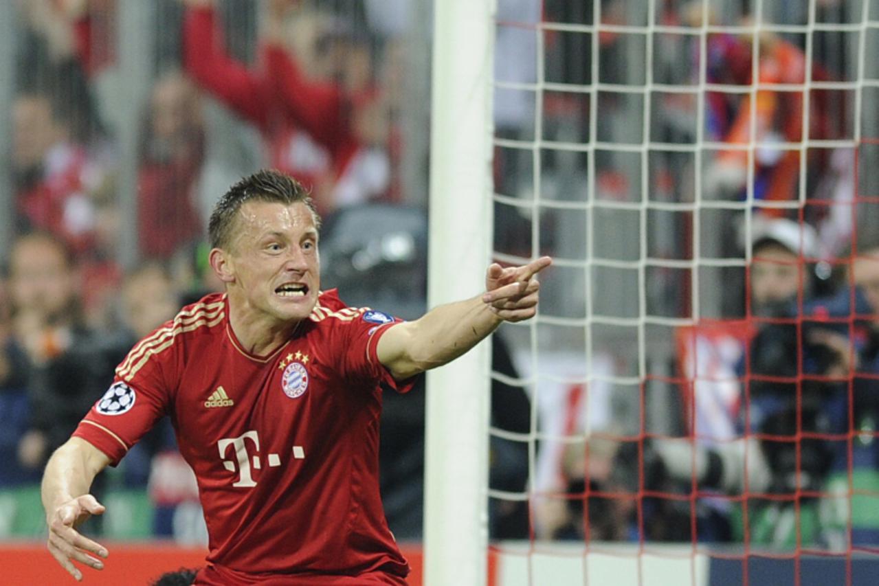 'Bayern Munich\'s Croatian striker Ivica Olic celebrates after scoring his first goal during the UEFA Champions League second leg quarter-final football match FC Bayern Munich vs Olympique de Marseill