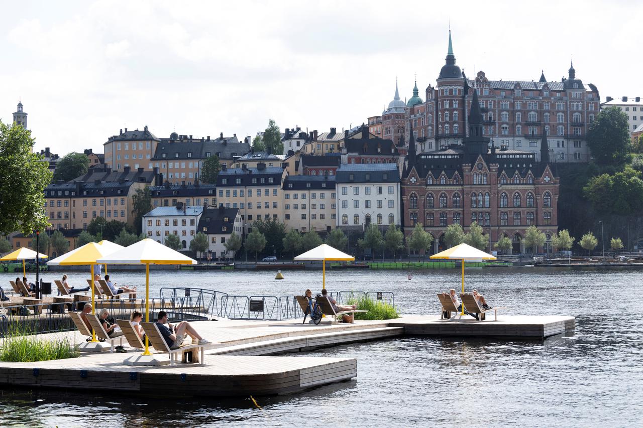 People enjoy warm summer weather in Stockholm