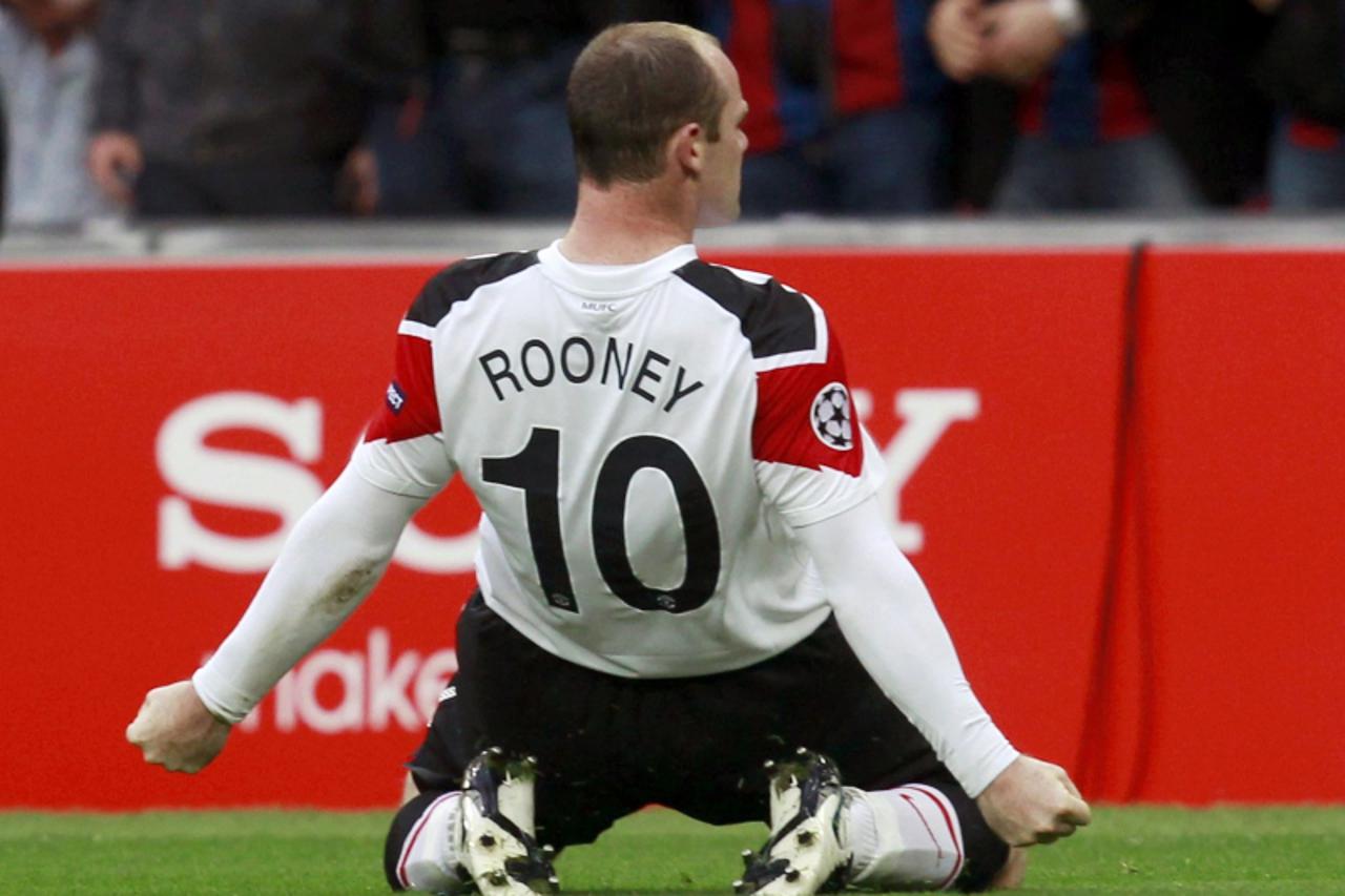 'Manchester United\'s Wayne Rooney celebrates a goal against Barcelona during their Champions League final soccer match at Wembley Stadium in London May 28, 2011.            REUTERS/Eddie Keogh (BRITA