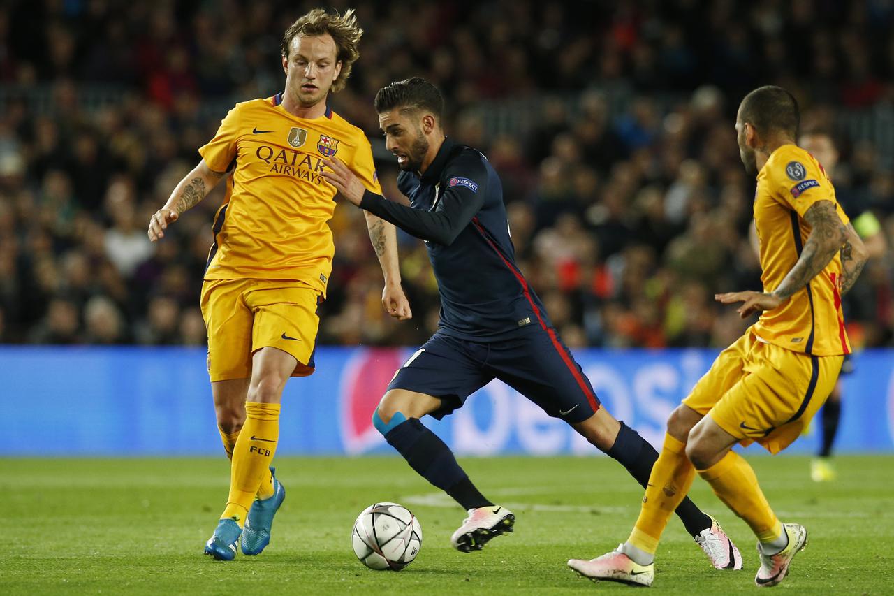 Football Soccer - FC Barcelona v Atletico Madrid - UEFA Champions League Quarter Final First Leg - The Nou Camp, Barcelona, Spain - 5/4/16 Atletico Madrid's Yannick Ferreira Carrasco in action with Barcelona's Ivan Rakitic Reuters / Albert Gea Livepic EDI