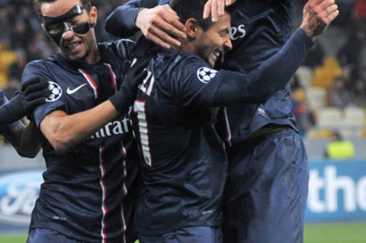 'Paris Saint-Germain\'s Ezequiel Lavezzi (C) is congratulated by team mates (from L) Nene and Zlatan Ibrahimovic after scoring a goal during an UEFA Champions League group A football match in Kiev on 