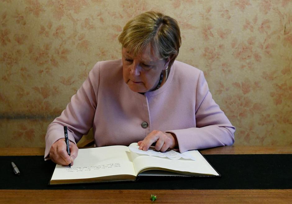 Former German Chancellor Merkel and Dutch PM Rutte visit the Anne Frank House in Amsterdam