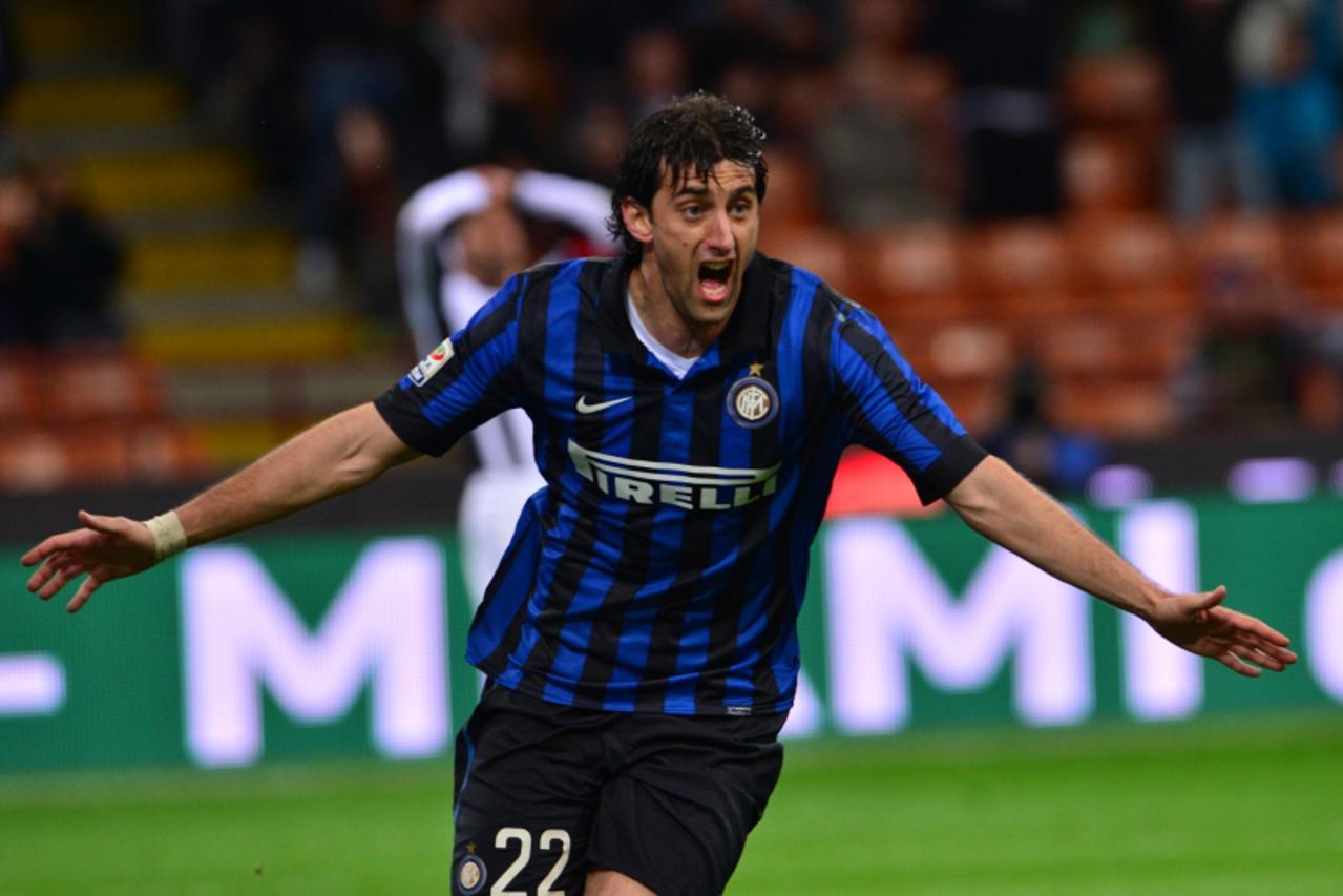 'Inter Milan\'s Argentine forward Diego Alberto Milito celebrates after scoring during the Serie A football match between Inter Milan and Siena at San Siro Stadium in Milan on April 11, 2012. AFP PHOT