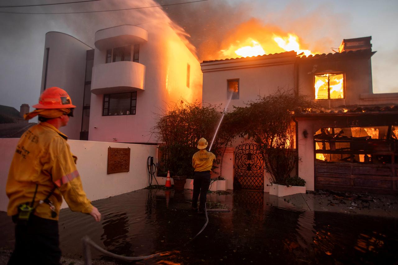 Palisades fire burns during a windstorm on the west side of Los Angeles