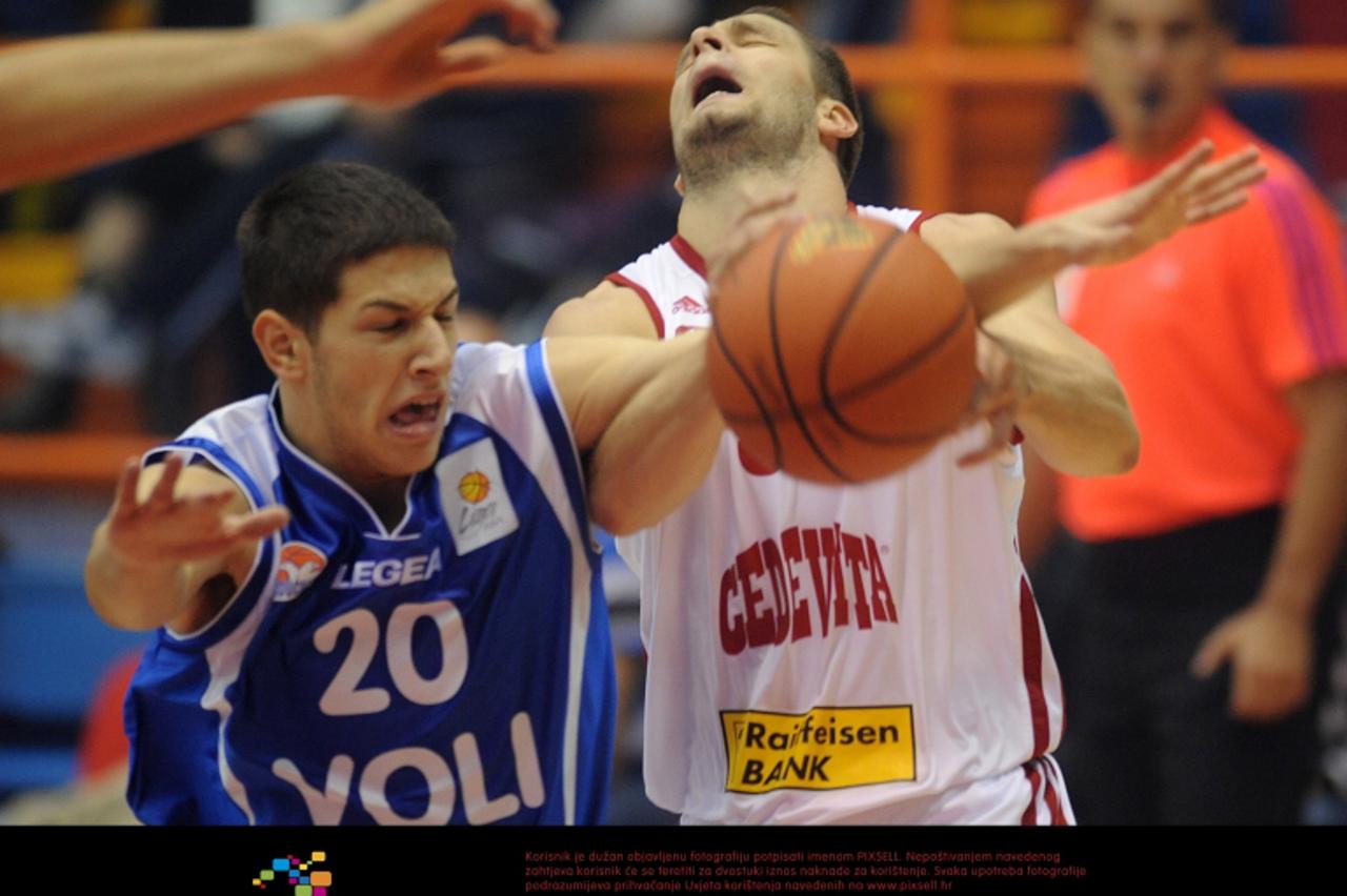 '07.10.2011., Zagreb - Kosarkaska utakmica, 1. kolo NLB lige,  KK Cedevita - KK Buducnost Voli. Nikola Ivanovic i Marko Car .  Photo: Daniel Kasap/PIXSELL'