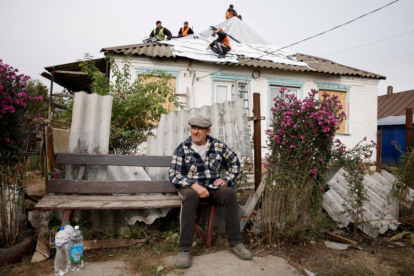 Volodymyr Kozienko sits in front of his damaged house next to the site of a Russian military strike, amid Russia's attack on Ukraine, in the village of Hroza, Kharkiv region, Ukraine October 6, 2023. REUTERS/Thomas Peter     TPX IMAGES OF THE DAY Photo: Thomas Peter/REUTERS