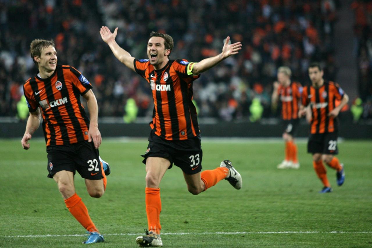 \'Capitan Darijo Srna (C) and Mykola Ishchenko (L) of FC Shakhtar react after their pre-term victory in the Ukraine National football championship in Donetsk on May 7, 2011. Shakhtar beat Metalurg 2-0