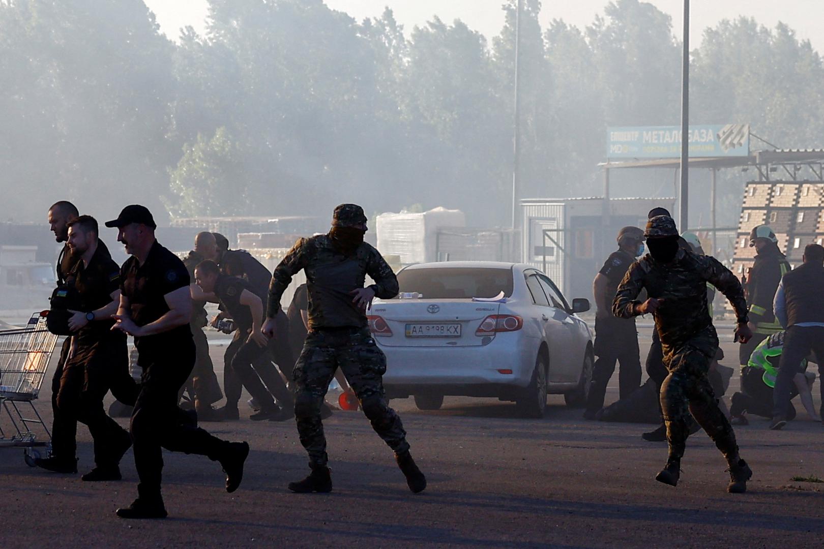 People run, after the announcement of a Russian missile attack towards Kharkiv, at the site of a household item shopping mall which was hit by a Russian air strike, amid Russia's attack on Ukraine, in Kharkiv, Ukraine, May 25, 2024. REUTERS/Valentyn Ogirenko Photo: VALENTYN OGIRENKO/REUTERS