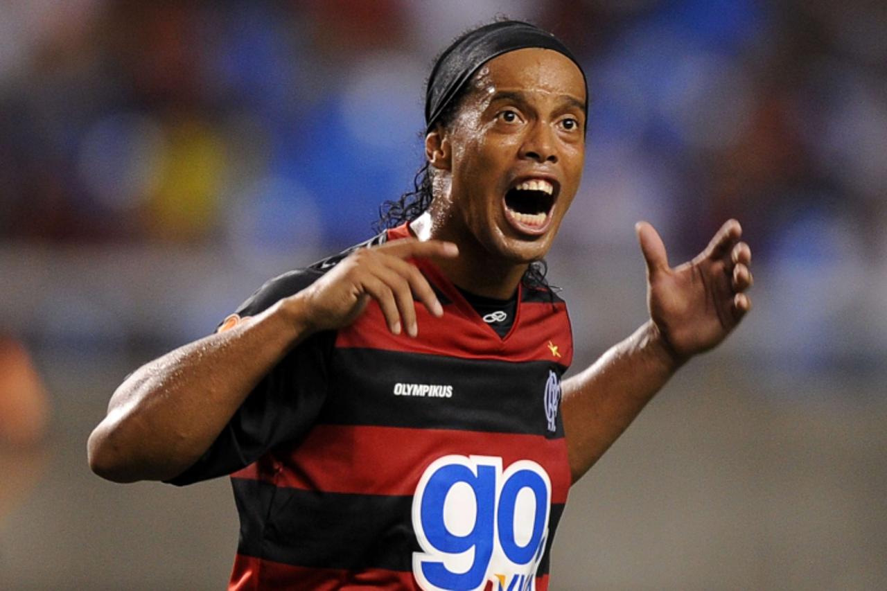 'Brazilian footballer Ronaldinho Gaucho gestures during hiss first match playing for Rio de Janeiro\'s team Flamengo against Nova Iguacu, on February 02, 2011 at the Engenhao (Joao Havelange) stadium 