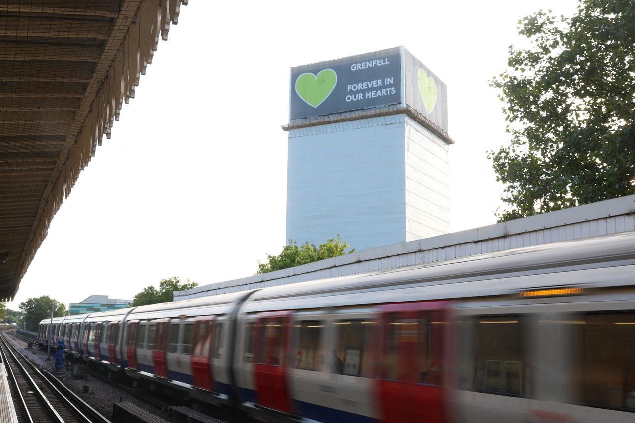 Covered remains of Grenfell Tower seen, as report from UK public inquiry into the deadly 2017 Grenfell fire published, in London