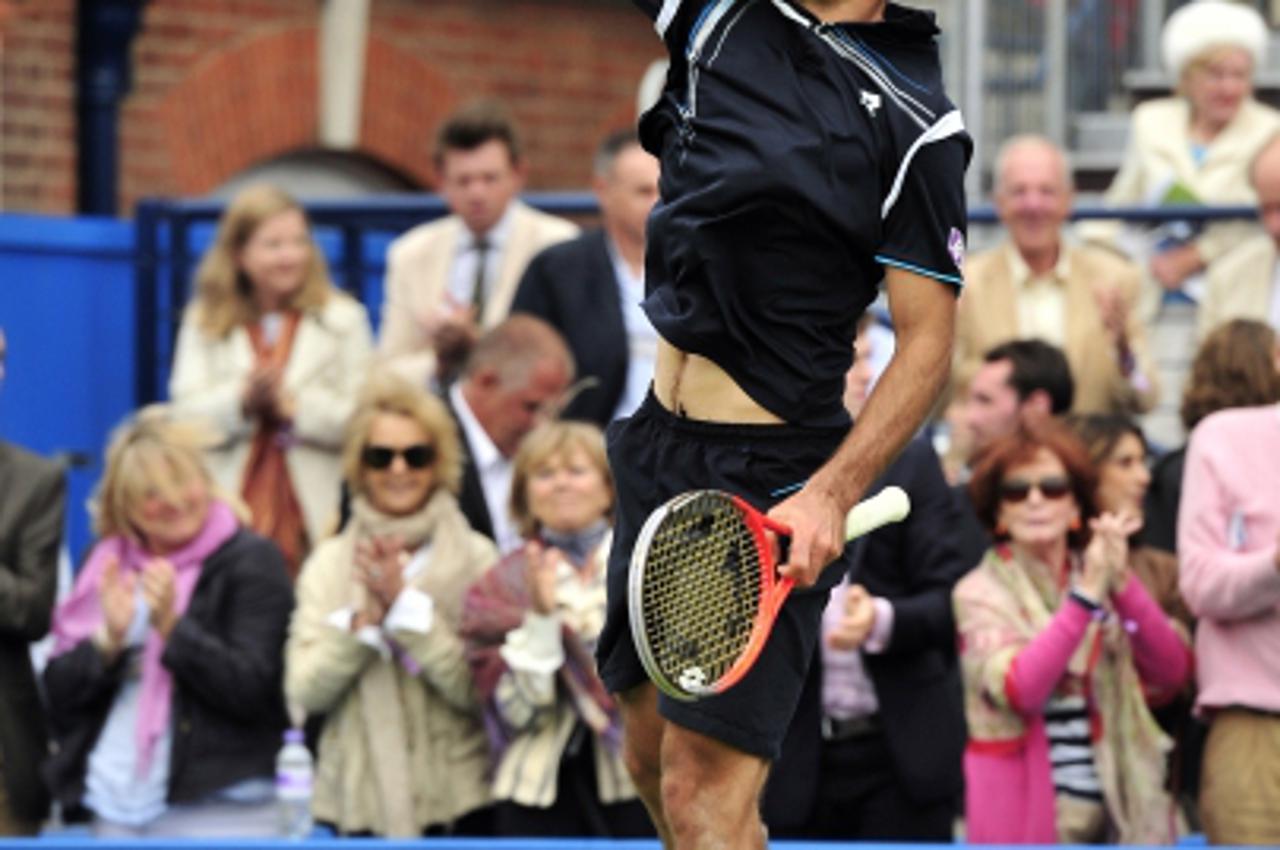 'Ivan Dodig of Croatia celebrates winning against Jo-Wilfried Tsonga of France during their men\'s singles third round match on the fourth day of the Aegon Championships tennis tournament at the Queen