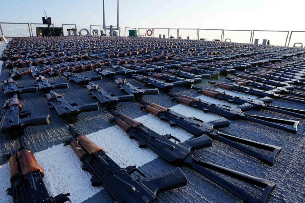 Thousands of AK-47 assault rifles sit on the flight deck of guided-missile destroyer USS The Sullivans (DDG 68) during an inventory process, in the Gulf of Oman in Arabian Sea