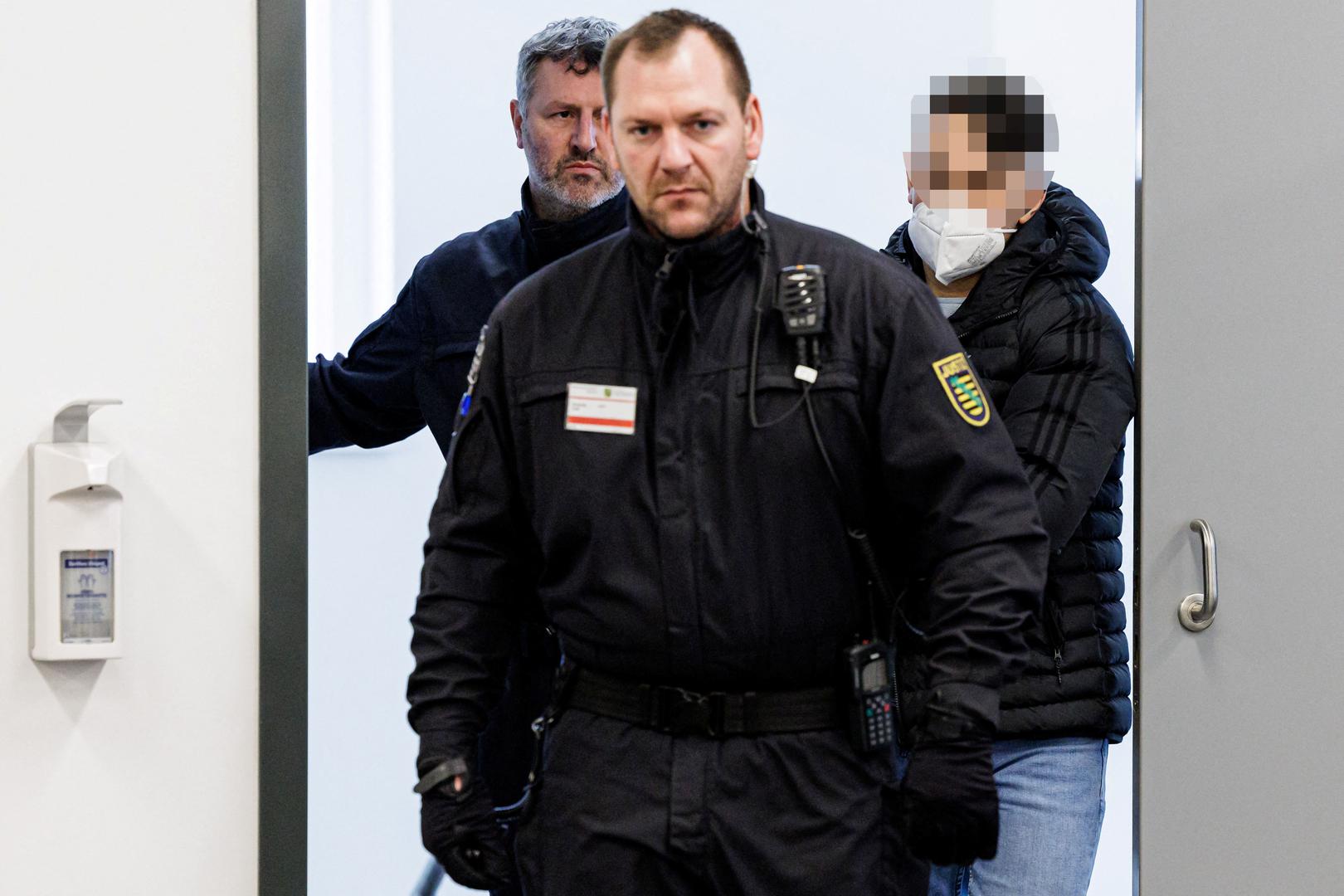 Defendant Bashir R. is led by a judicial officer into the courtroom of the Higher Regional Court prior to a hearing in the trial over a November 2019 jewellery heist on the Green Vault (Gruenes Gewoelbe) museum in Dresden's Royal Palace, in Dresden, Germany, March 20, 2023. Jens Schlueter/Pool via REUTERS Photo: POOL/REUTERS