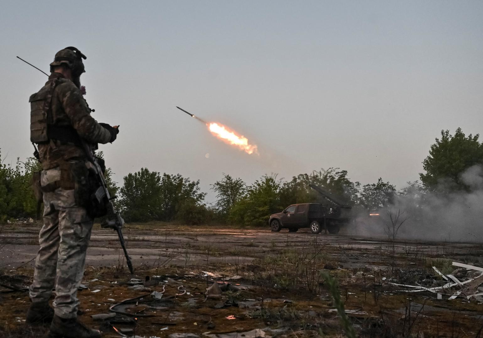 A member of the company tactical group "Steppe Wolves" of the Voluntary Formation of the Zaporizhzhia Territorial Community stands as they fire a handmade small multiple rocket launch system toward Russian troops near a front line, amid Russia's attack on Ukraine, in Zaporizhzhia region, Ukraine April 27, 2024. REUTERS/Stringer Photo: Stringer/REUTERS