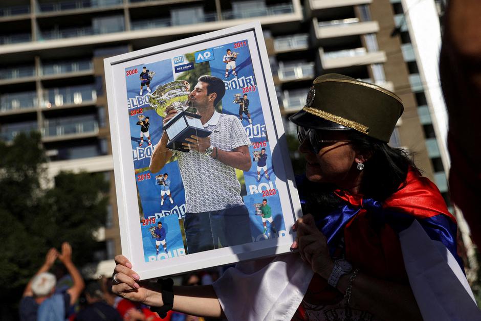 Supporters gather outside the hotel where Novak Djokovic is believed to be held in Melbourne