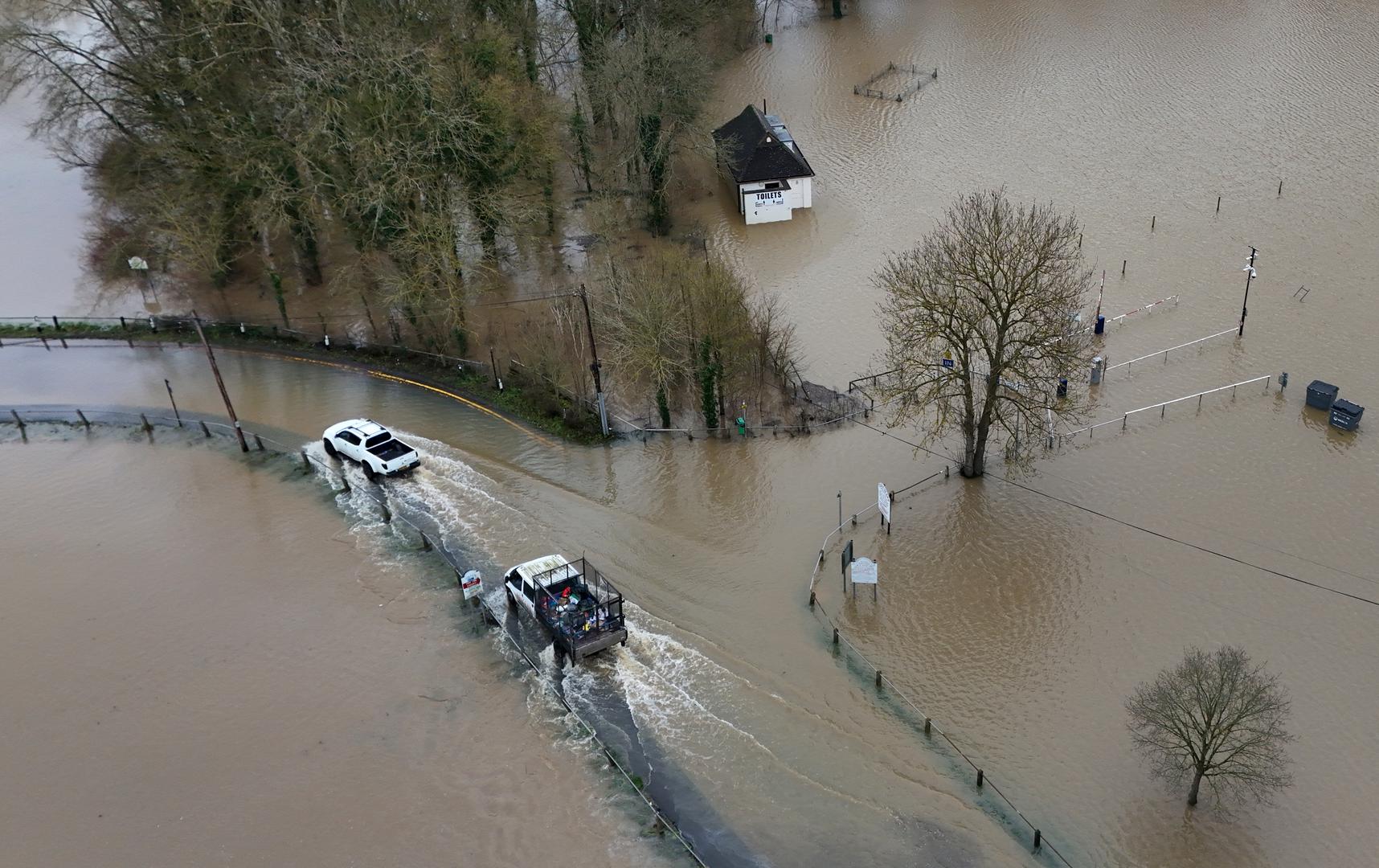 Cars pass through flood waters in Yalding, Kent. Weather warnings remain in force across much of the UK on Monday with adverse conditions, including flooding from heavy rain and thawing snow. Picture date: Monday January 6, 2025. Photo: Gareth Fuller/PRESS ASSOCIATION