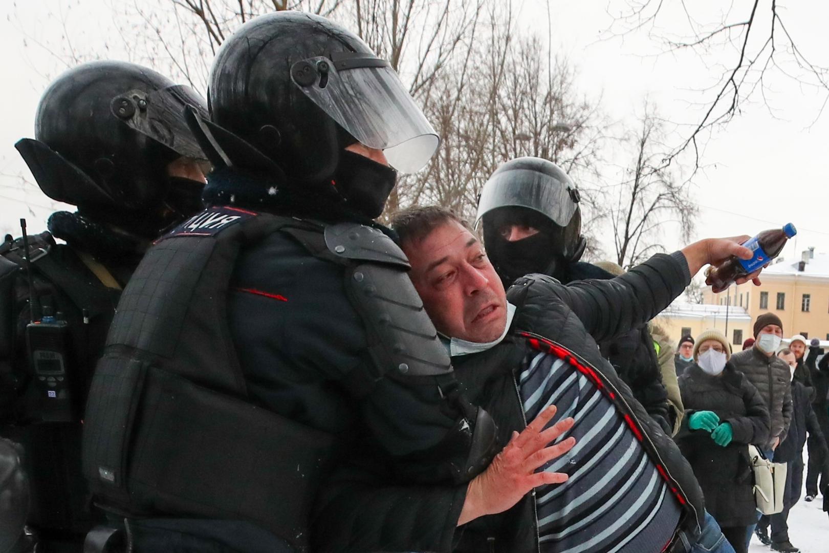 ST PETERSBURG, RUSSIA - JANUARY 31, 2021: Police officers detain a demonstrator during an unauthorised protest in support of the detained opposition activist Alexei Navalny. Navalny, who had been handed a suspended sentence in the Yves Rocher case in 2014, was detained at Sheremetyevo Airport near Moscow on 17 January 2021 for violating probation conditions. A court ruled that Navalny be put into custody until 15 February 2021. Peter Kovalev/TASS Photo via Newscom Newscom/PIXSELL