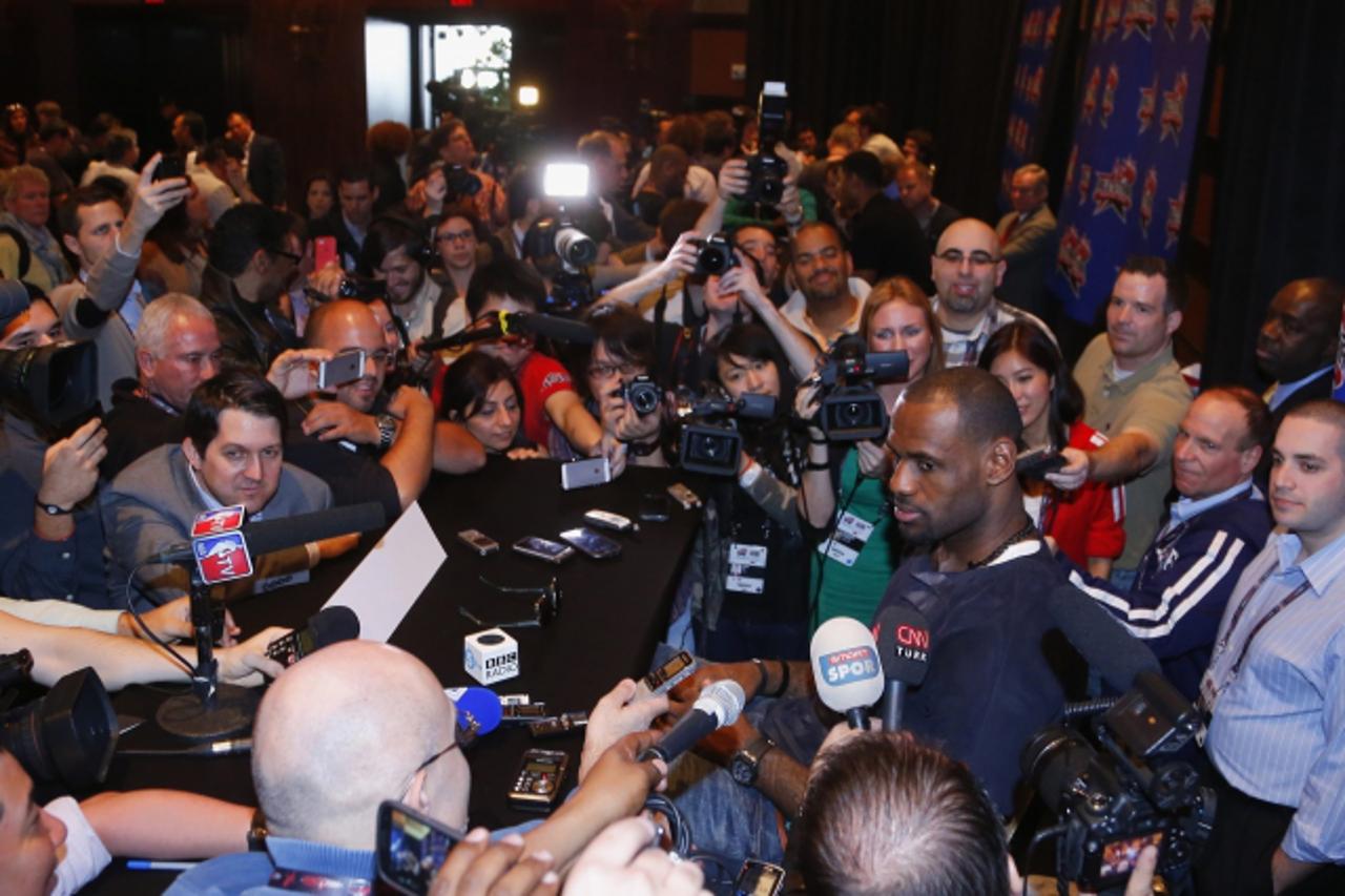 'Miami Heat's forward Lebron James listens to a question during media availability for the NBA All-Star basketball game in Houston, Texas, February 15, 2013. The All-Star game will be played on Febru