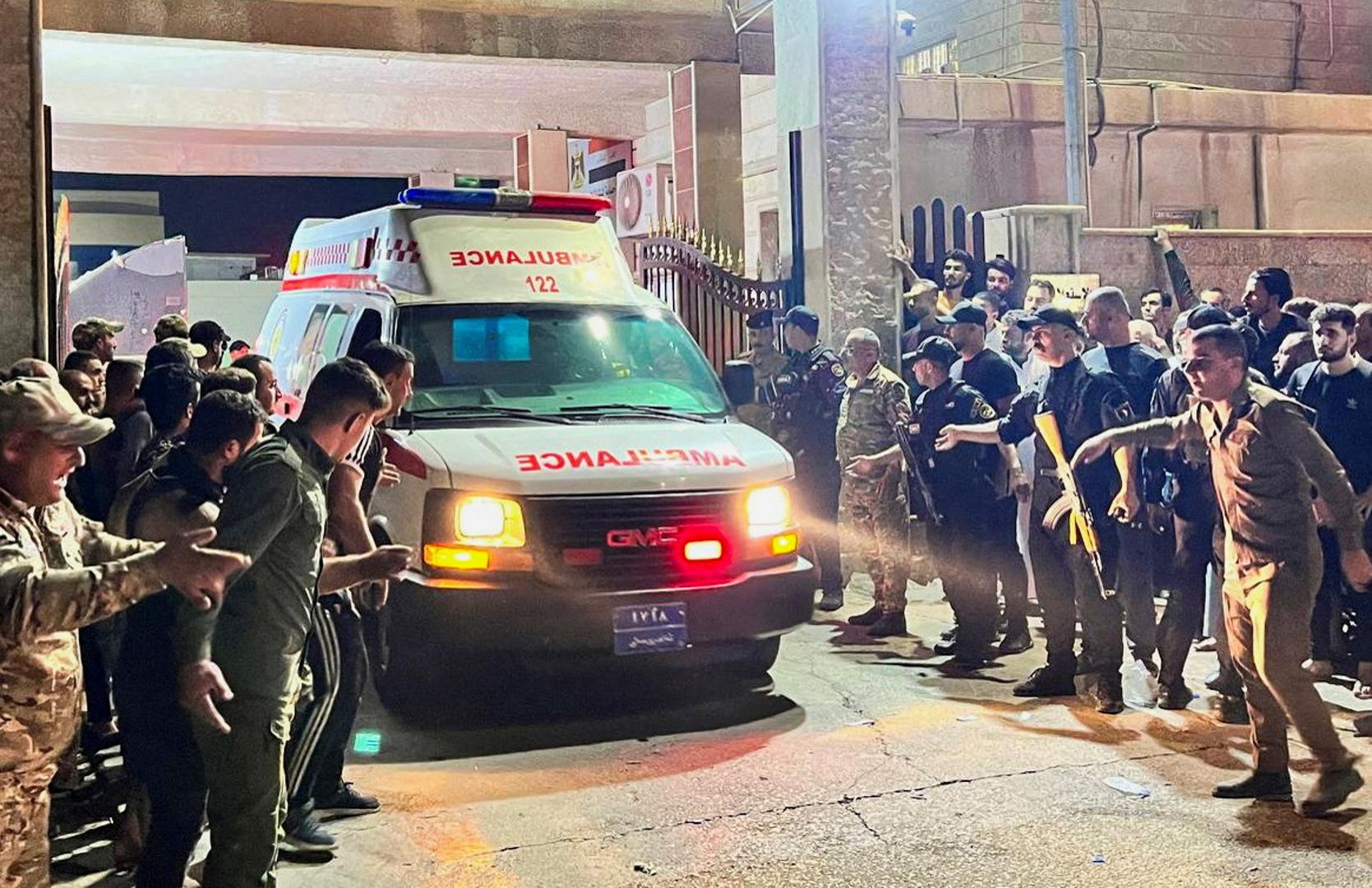 Security forces and emergency responders among others gather around ambulances carrying wounded people following a fatal fire at a wedding celebration, in the district of Hamdaniya in Iraq's Nineveh province, Iraq, September 27, 2023. REUTERS/Abdullah Rashid Photo: ABDULLAH RASHID/REUTERS