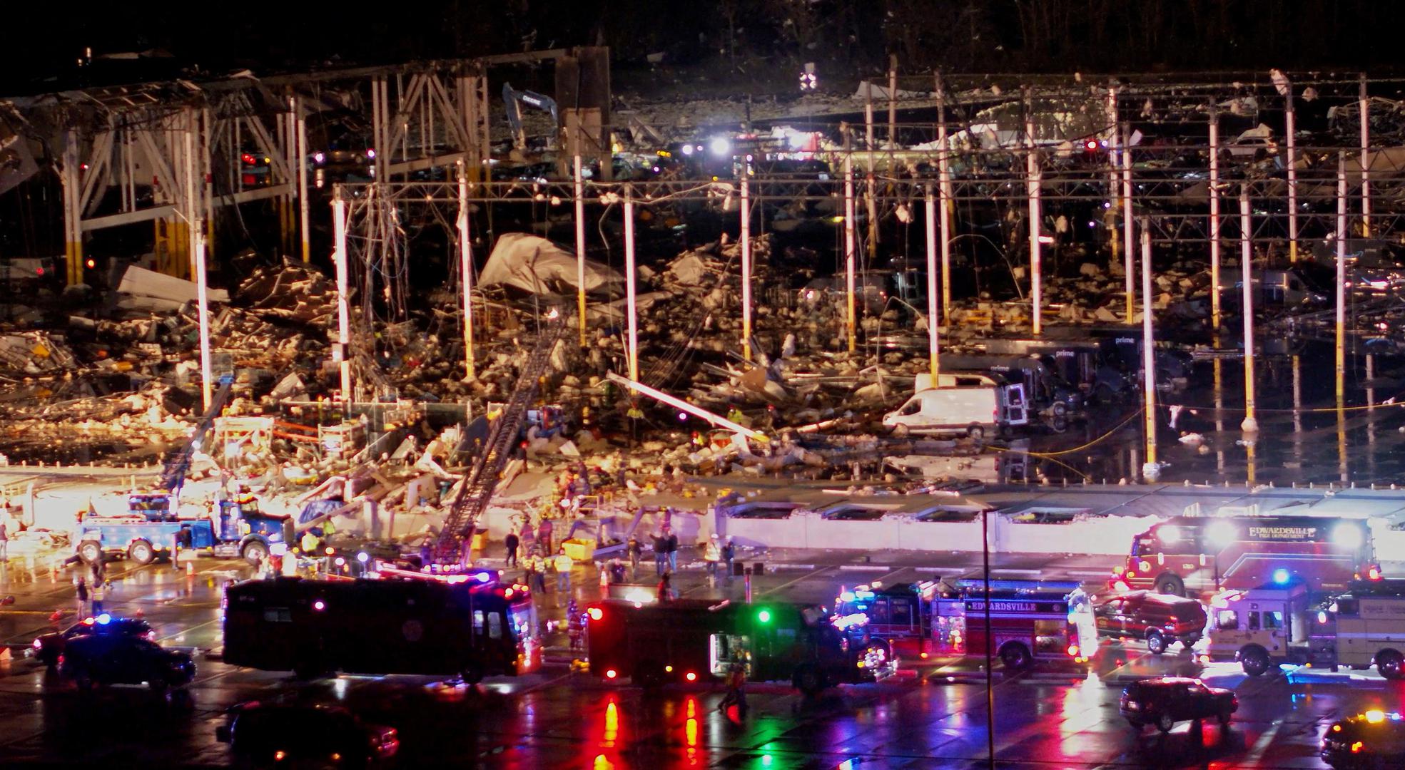 Emergency crews respond to a collapsed Amazon.com warehouse after a tornado passed through Edwardsville, Illinois, U.S., December 10, 2021 in a still image taken from drone video obtained on December 11, 2021. Chris Phillips/Maverick Media Group, LLC via REUTERS  THIS IMAGE HAS BEEN SUPPLIED BY A THIRD PARTY. MANDATORY CREDIT