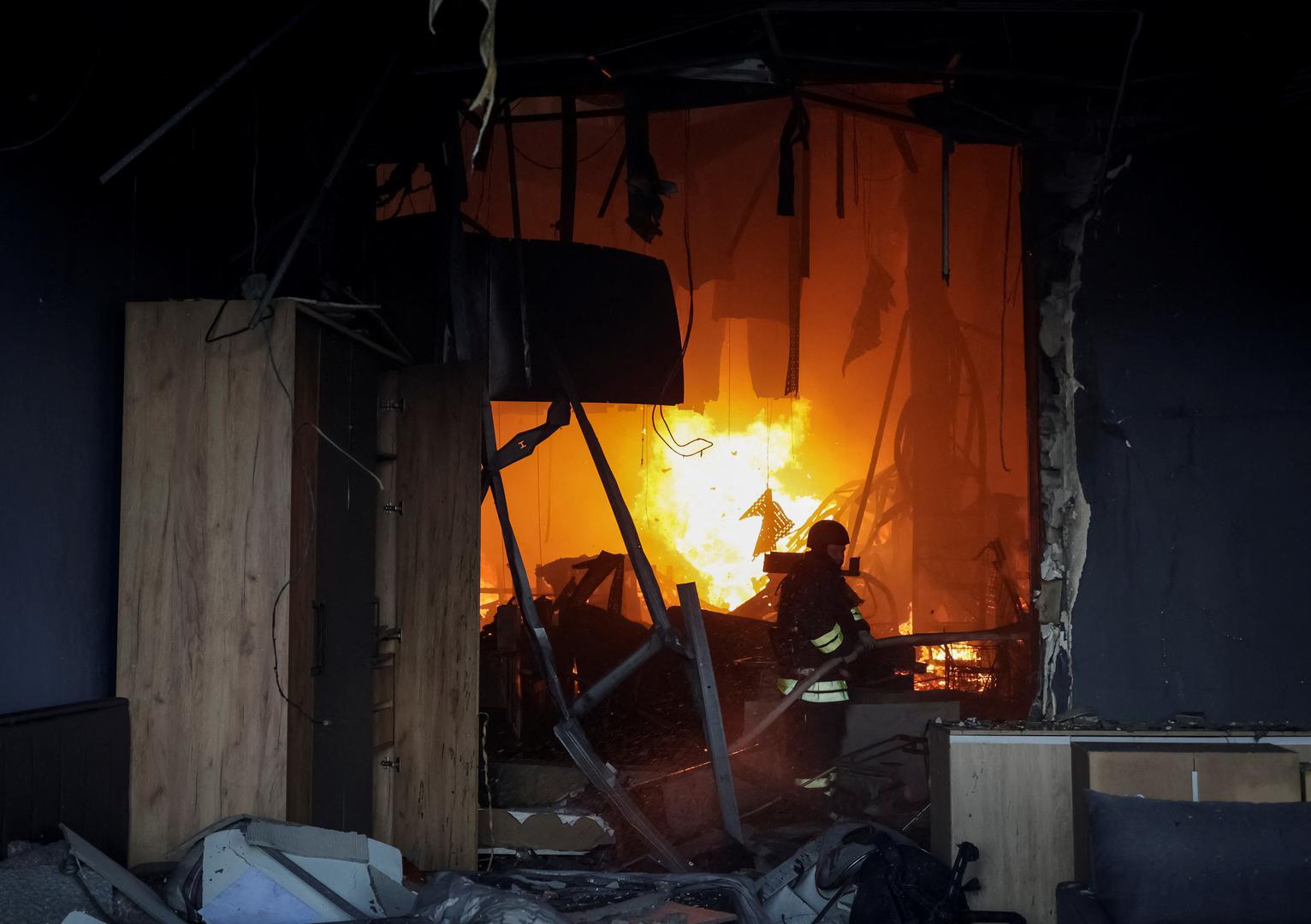 A firefighter works at a site of a household item shopping mall hit by a Russian air strike, amid Russia's attack on Ukraine, in Kharkiv, Ukraine May 25, 2024. REUTERS/Sofiia Gatilova Photo: Sofiia Gatilova/REUTERS