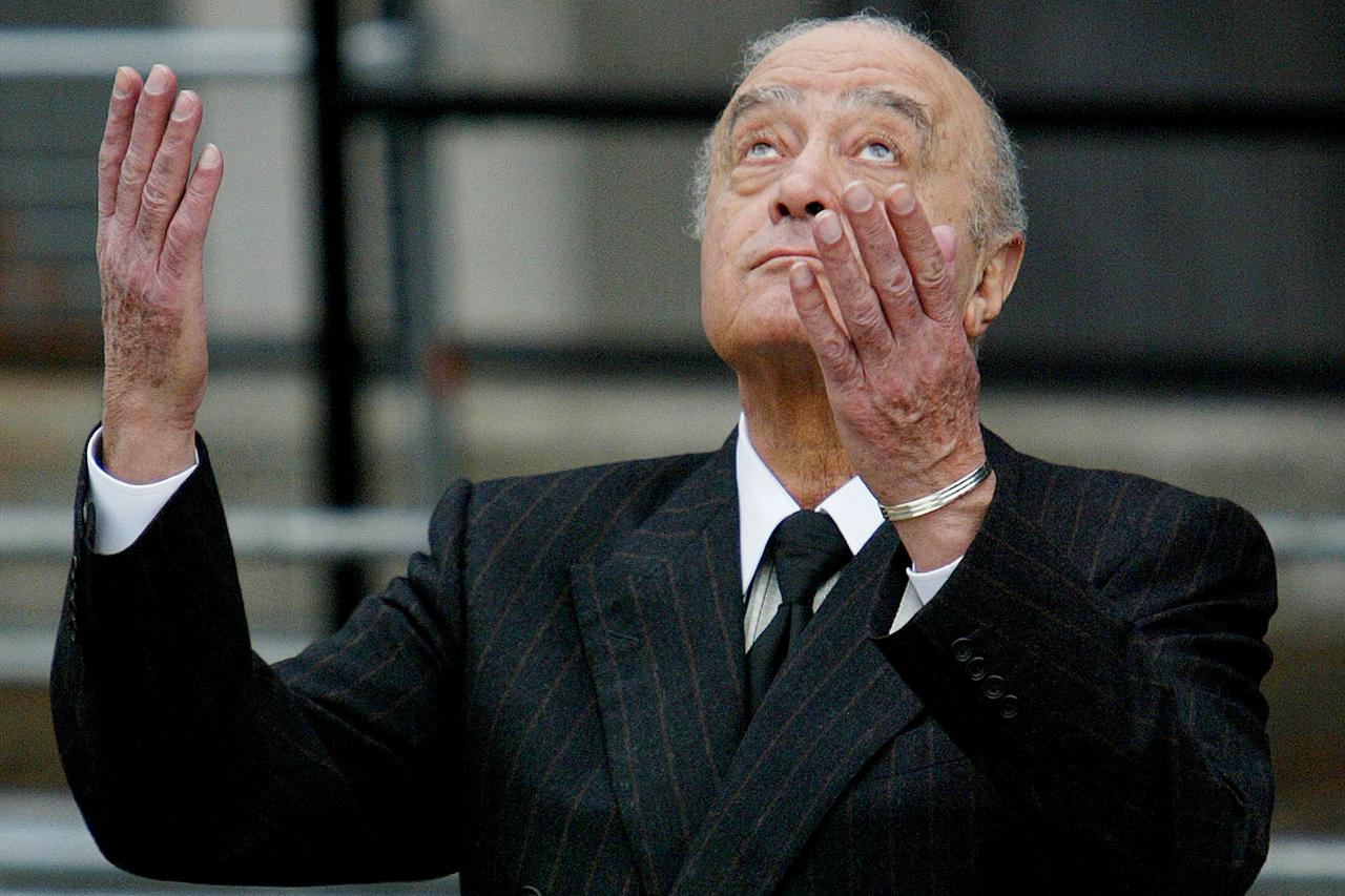 FILE PHOTO: MOHAMED AL FAYED GESTURES AS HE LEAVES OPENING OF BRITISH INQUEST INTO DEATH OF PRINCESS DIANA IN LONDON.