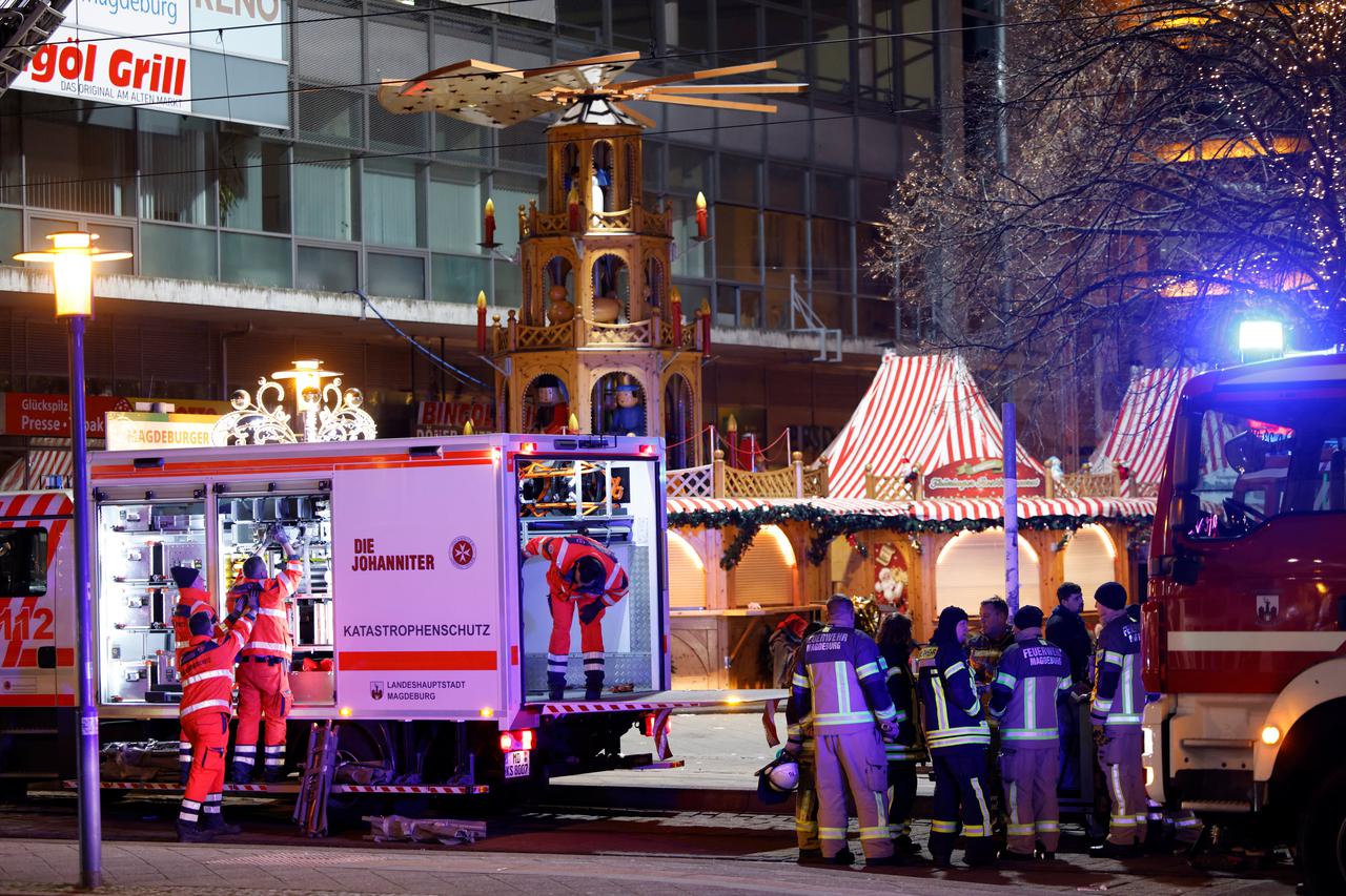 Emergency personnel work at a Christmas market after a car drove into a group of people, in Magdeburg