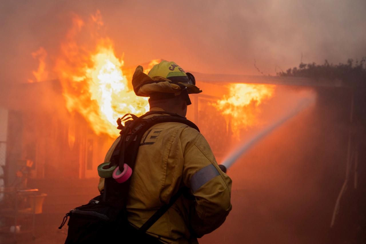 Palisades Fire burns during a windstorm on the west side of Los Angeles