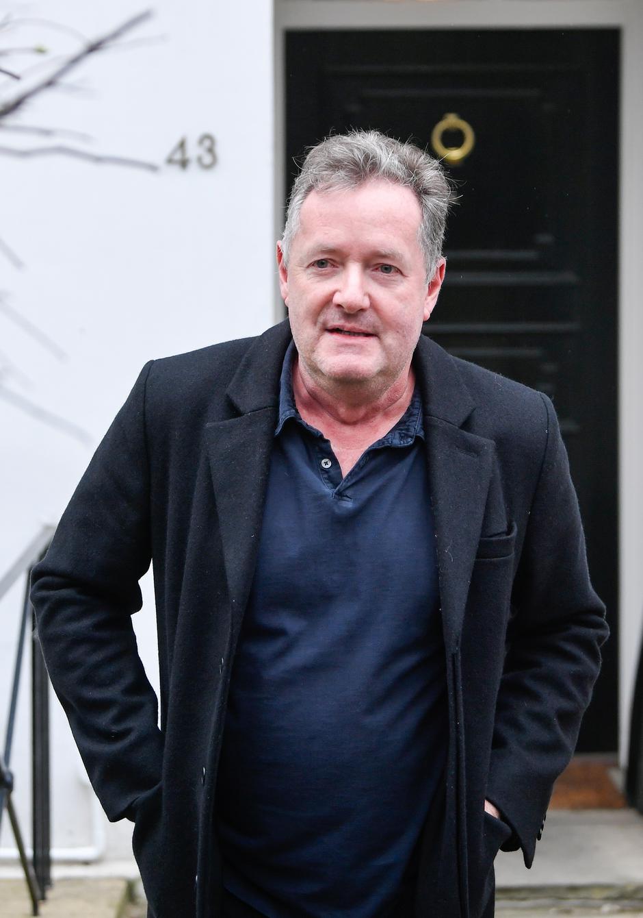 Piers Morgan walks near his house in London