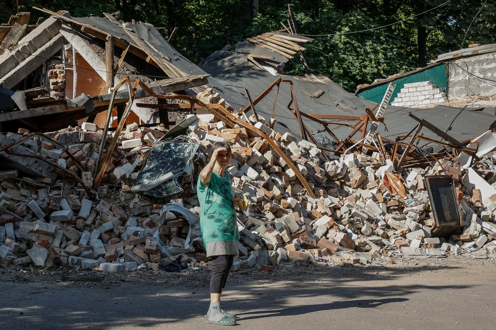 A local resident, who refuses to be evacuated, stands in front of a destroyed building, amid Russia's attack on Ukraine, in the town of Toretsk, near a front line in Donetsk region, Ukraine July 3, 2024. REUTERS/Alina Smutko Photo: ALINA SMUTKO/REUTERS