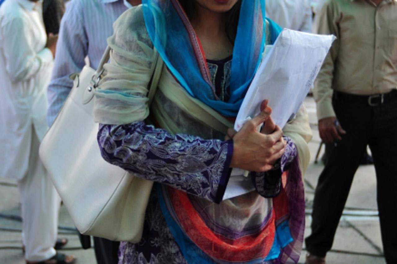 'Pakistani Foreign Minister Hina Rabbani Khar arrives to attend the assembly session at the parliament in Islamabad on May 9, 2011. Pakistan met US demands for an inquiry into how Osama bin Laden live