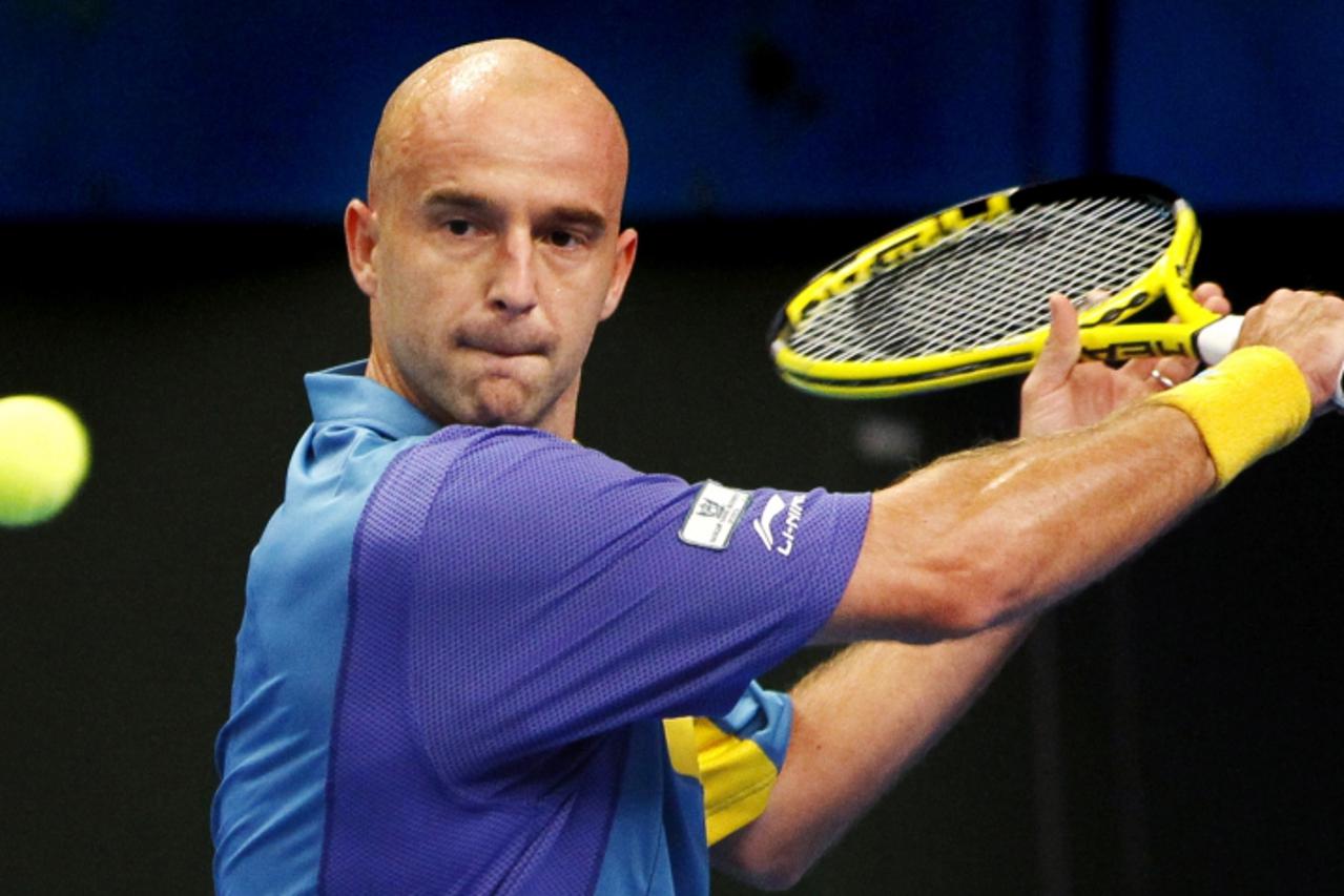 'Ivan Ljubicic of Croatia hits a return to Arnaud Clement of France during their second round match at the Stockholm Open tennis tournament in Stockholm October 21, 2010.  REUTERS/Bob Strong    (SWEDE