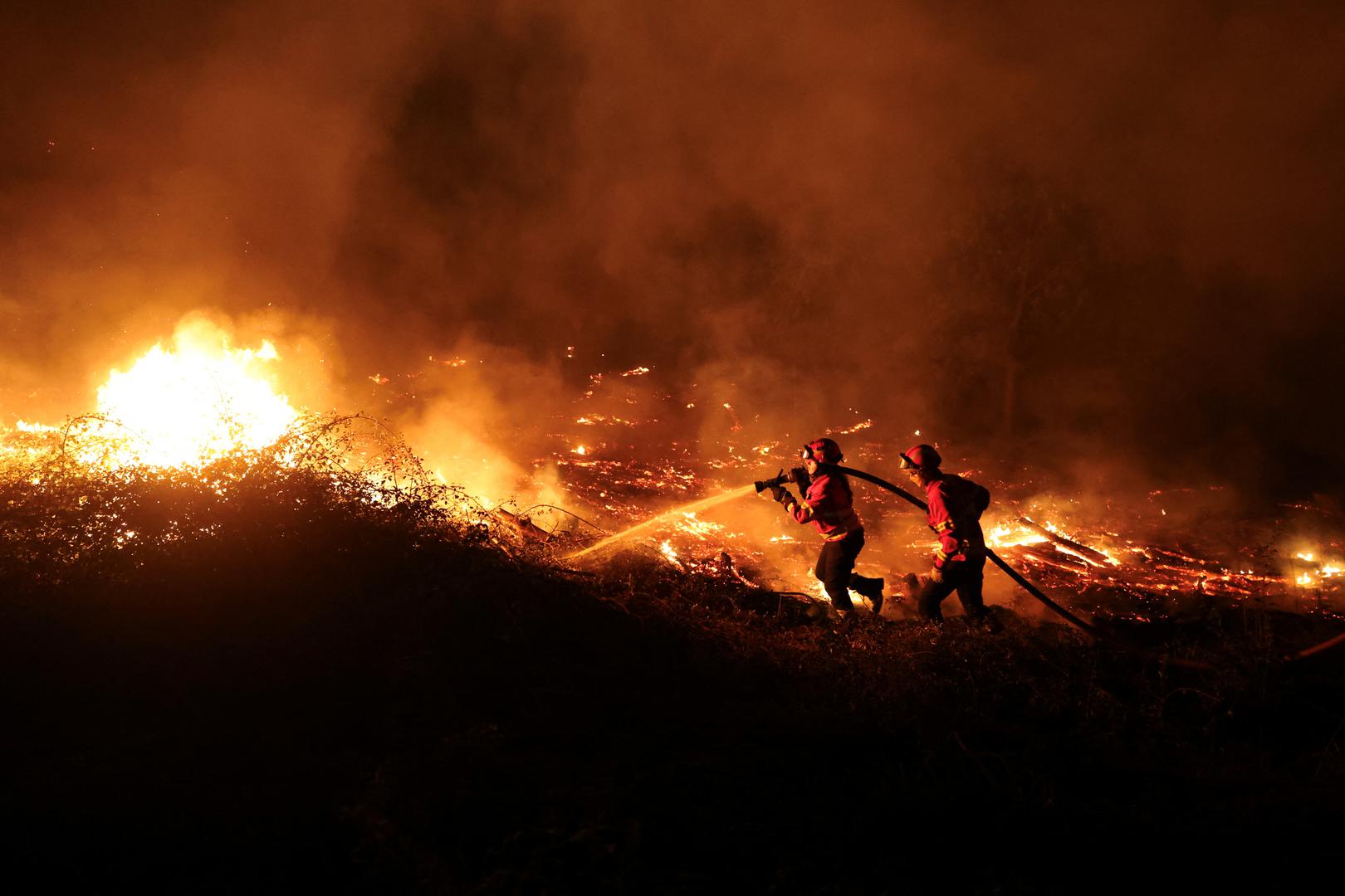 Firefighters try to extinguish a wildfire in Canas de Senhorim, Portugal, September 16, 2024. REUTERS/Pedro Nunes Photo: PEDRO NUNES/REUTERS