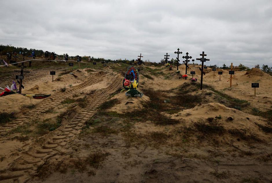 A view of graves which Ukrainian officials say is a civilian  mass grave, in the newly recaptured town of Lyman,