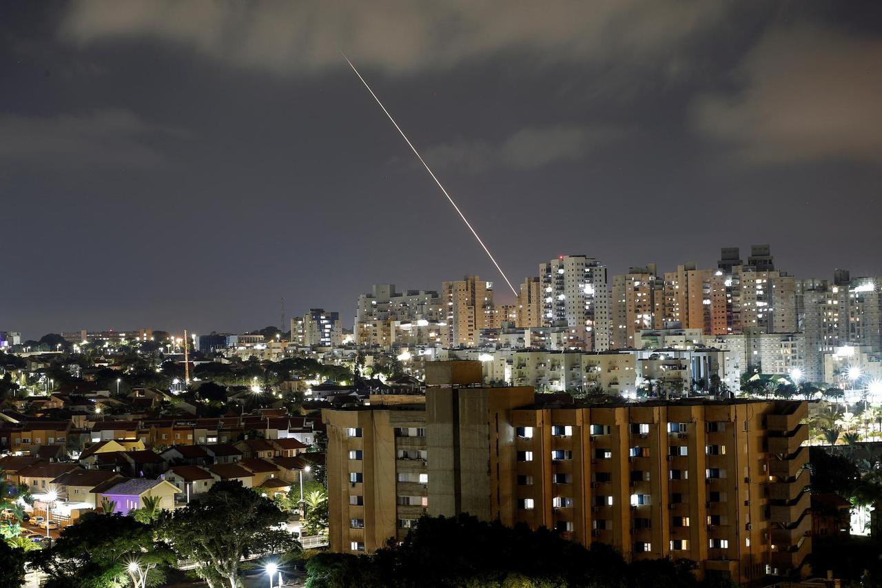 A streak of light is seen as a rocket been launched from the Gaza Strip towards Israel, as seen from Ashkelon