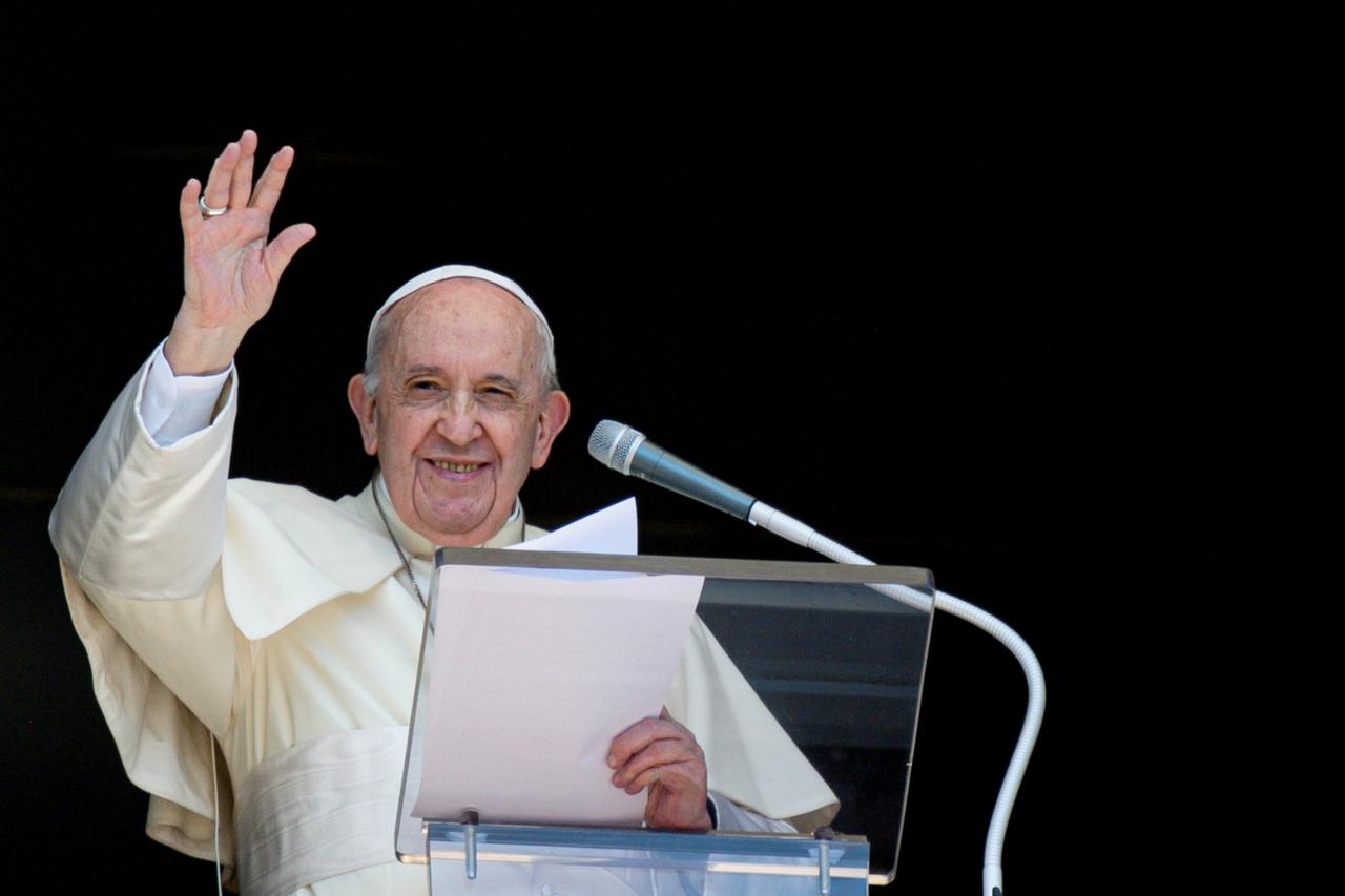 FILE PHOTO: Pope Francis leads Angelus prayer from window at the Vatican