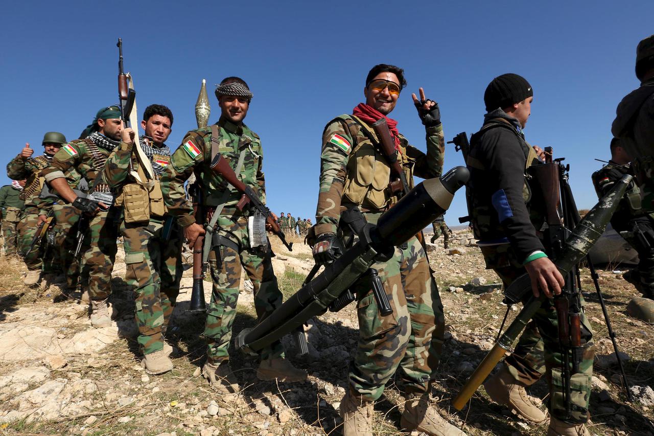 Members of the Kurdish peshmerga forces gather in the town of Sinjar, Iraq November 13, 2015. Kurdish peshmerga forces secured several strategic facilities in the northern Iraqi town of Sinjar on Friday as part of an offensive against Islamic State milita