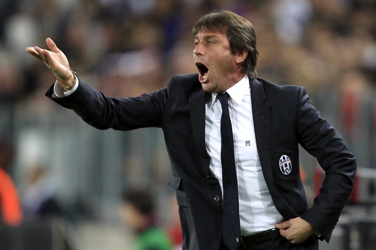 'Juventus\' coach Antonio Conte reacts during their Italian Serie A soccer match against AS Roma at the Juventus Stadium in Turin in this April 22, 2012 file photo. Italian police investigating a socc