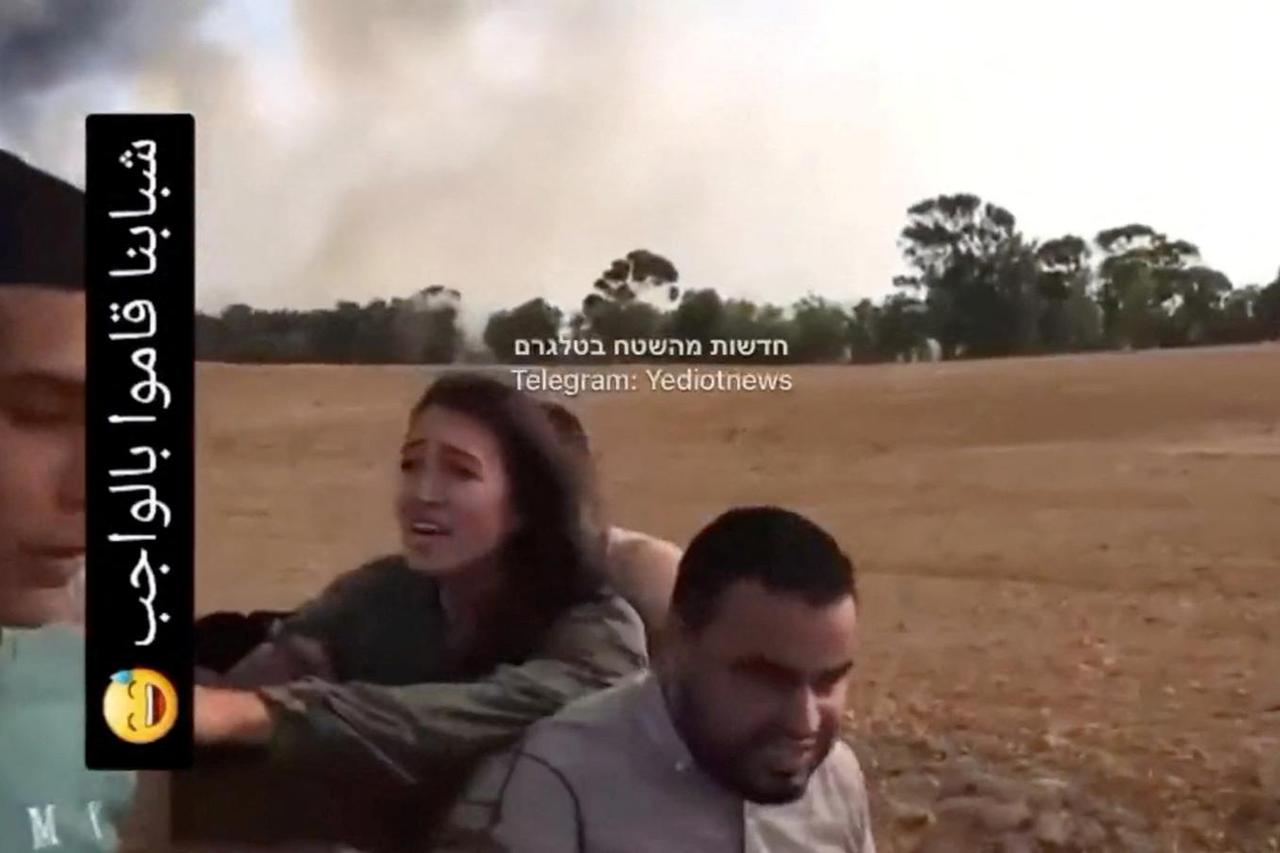 A screengrab from a social media video published on October 7, 2023 shows Noa Argamani as she is taken hostage by Palestinian militants