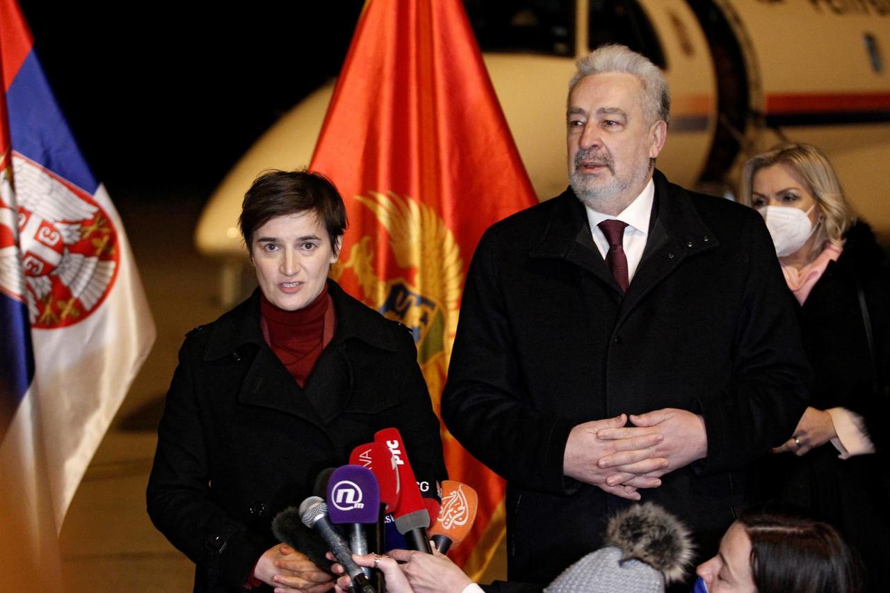 Montenegro's PM Krivokapic (R) welcomes his Serbian counterpart Brnabic to receive a Sputnik V vaccine donation in Podgorica