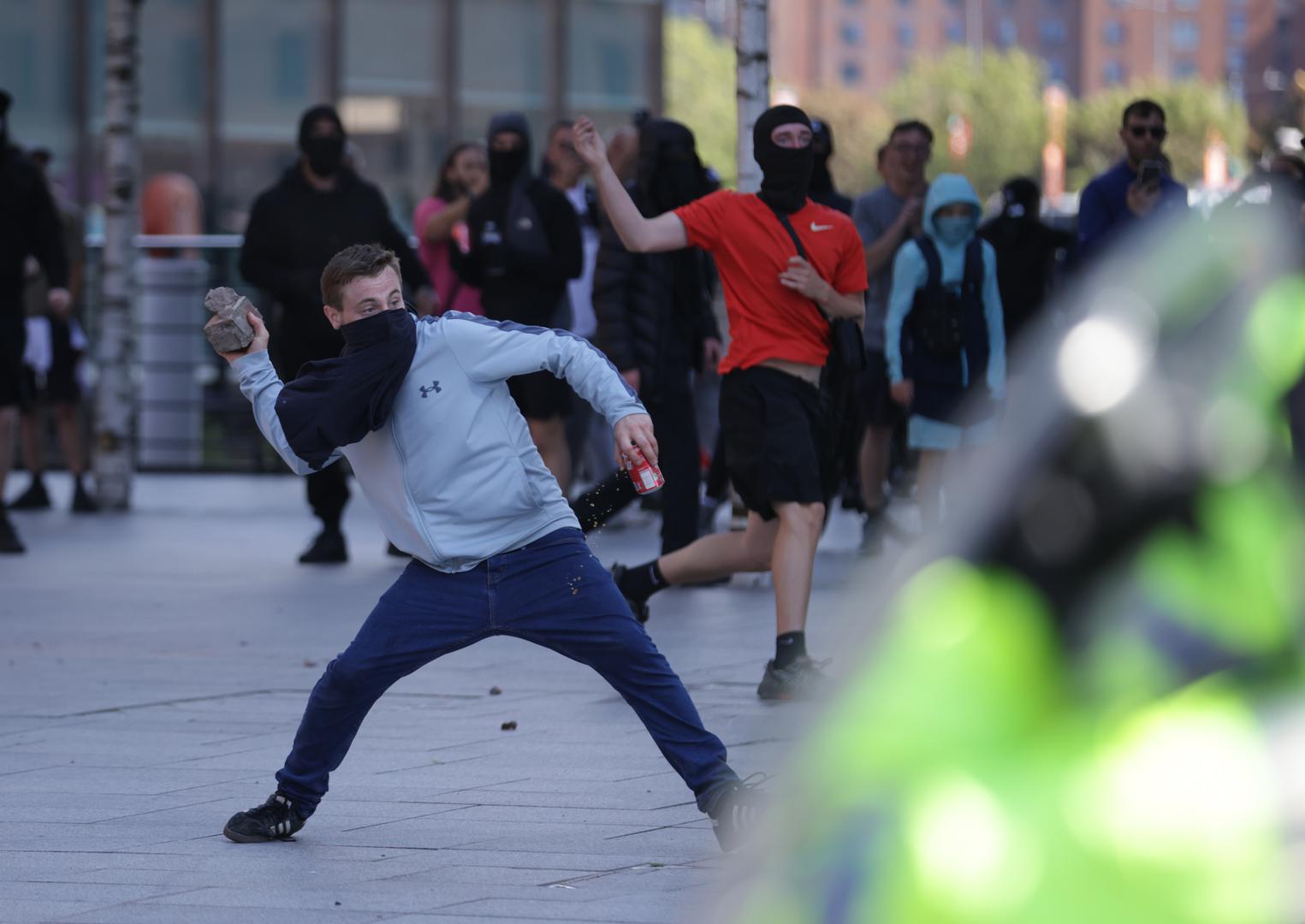 A man throws a brick during a protest in Liverpool, following the stabbing attacks on Monday in Southport, in which three young children were killed. Picture date: Saturday August 3, 2024. Photo: James Speakman/PRESS ASSOCIATION